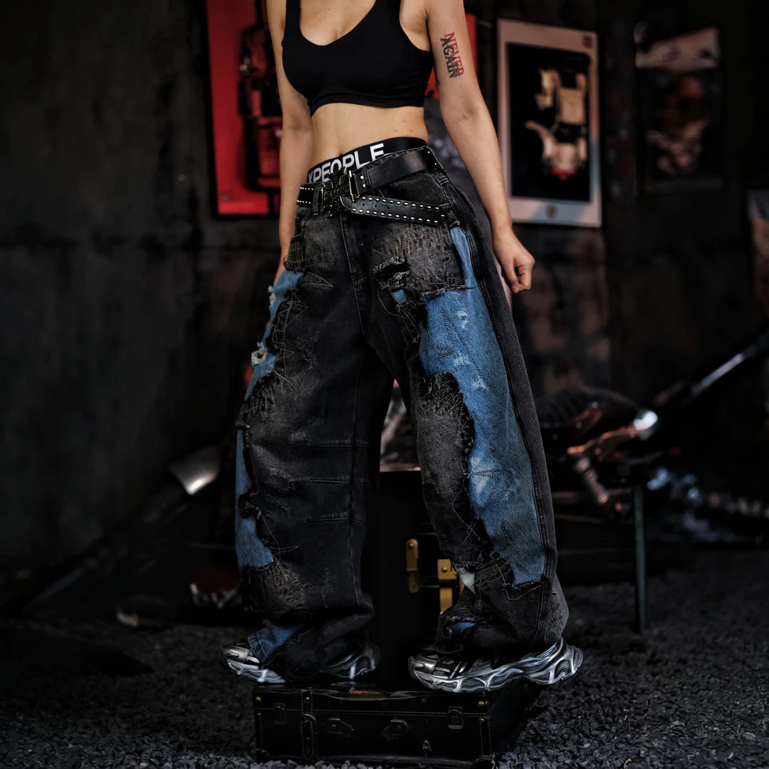 Sanhoostudio denim pants featuring vintage washed treatment, distressed detailing, asymmetric patchwork construction, and a relaxed silhouette. Designed for statement streetwear styling with rugged denim texture, unconventional panel structure, comfortable movement, and distinctive everyday urban appeal.
