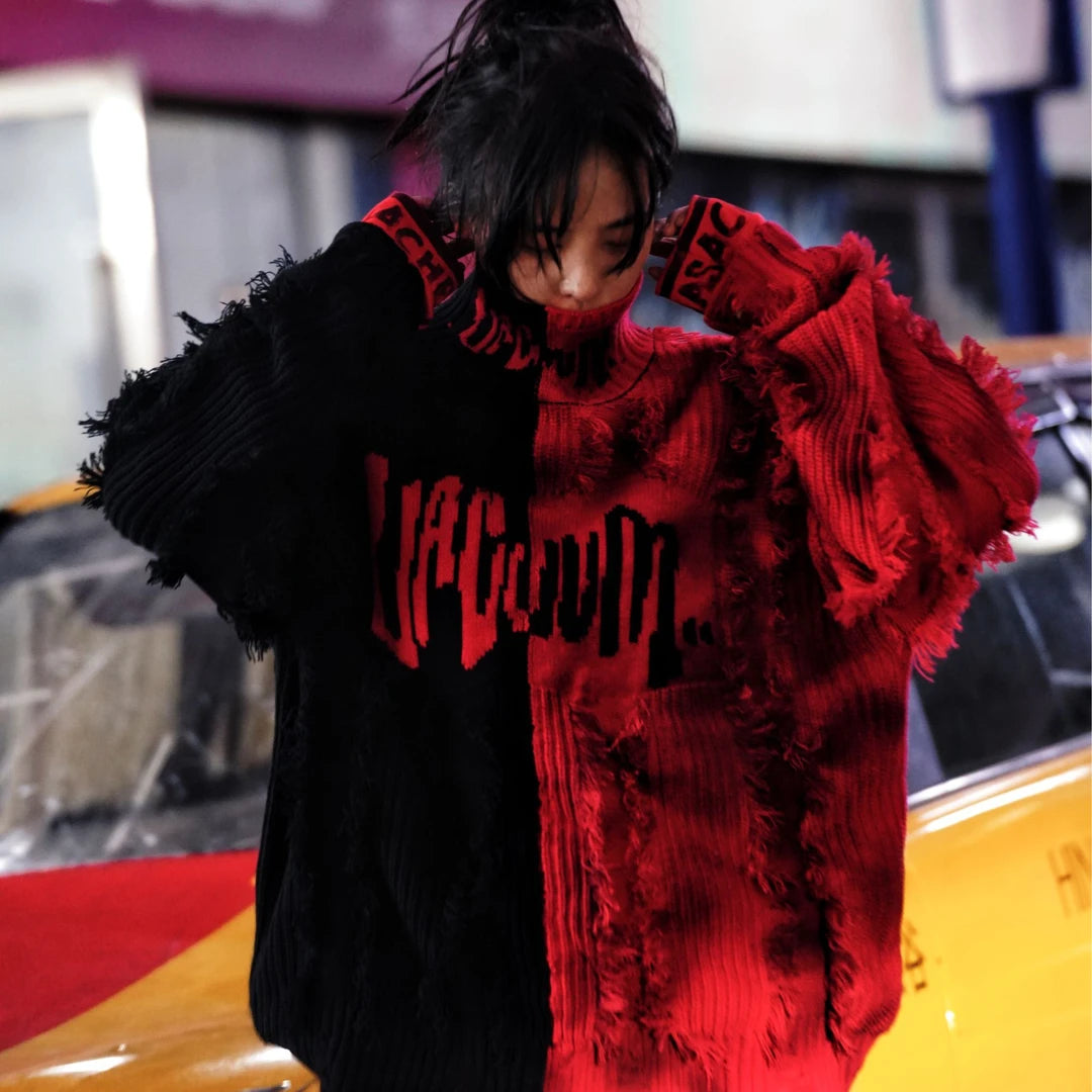 Sanhoostudio knit sweater featuring a bold black and red colorway, heavyweight woven construction, distressed graffiti artwork, hand-painted detailing, and asymmetric patchwork elements. Designed with a relaxed oversized silhouette for statement streetwear styling and distinctive deconstructed appeal.