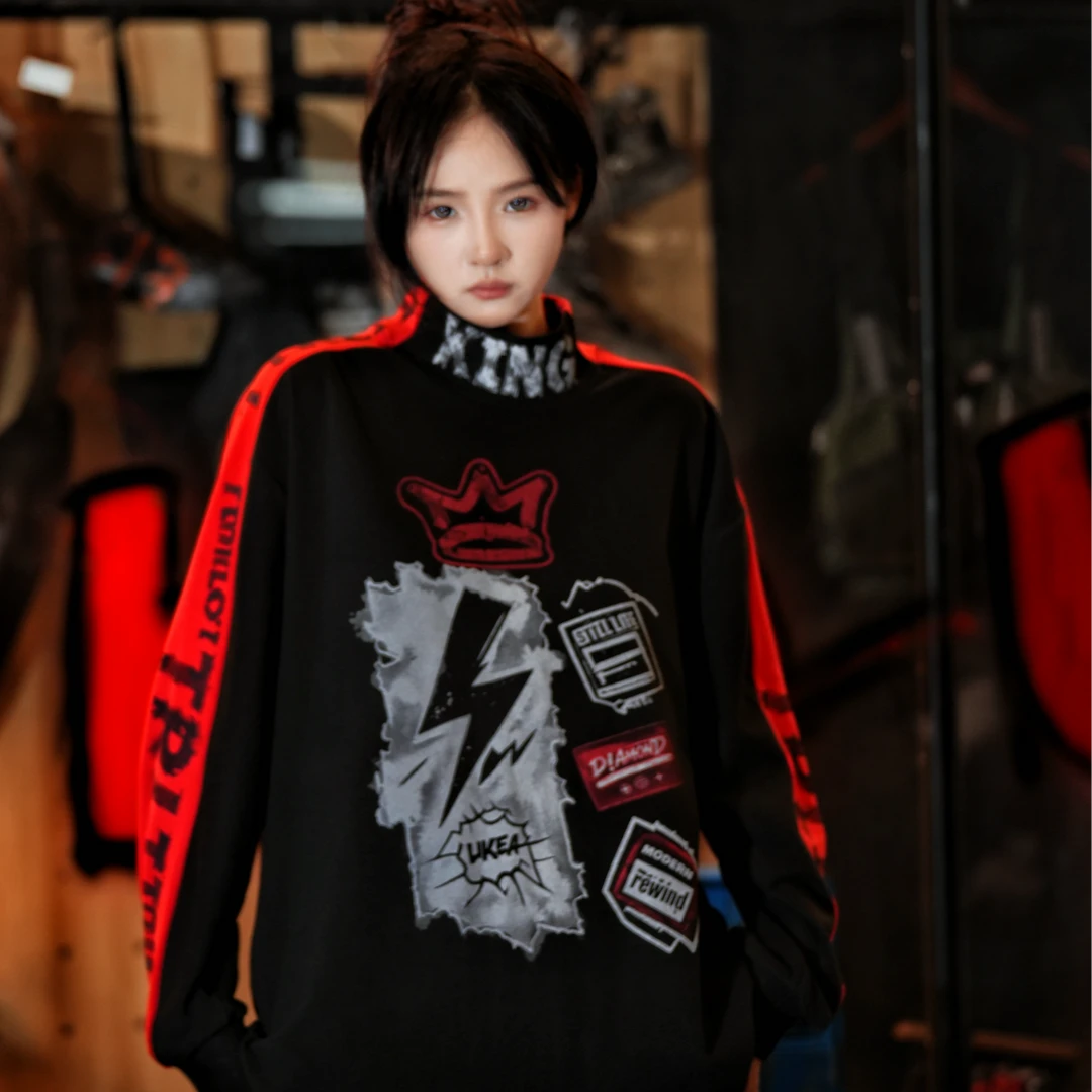 Sanhoostudio thermal long sleeve T-shirt featuring graffiti-inspired scan graphics, soft thermal fabric, asymmetric detailing, and a relaxed oversized silhouette. Designed for contemporary streetwear layering with comfortable warmth, distinctive digital artwork, and versatile everyday styling.