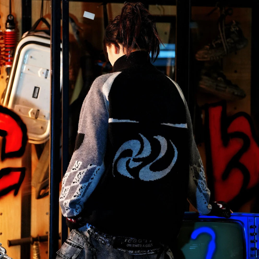 Sanhoostudio knit sweater featuring heavyweight knitted construction, hand-painted graphic detailing, asymmetric patchwork elements, and a relaxed oversized silhouette. Designed for statement streetwear styling with distinctive artistic textures, comfortable warmth, deconstructed aesthetics, and versatile layering.