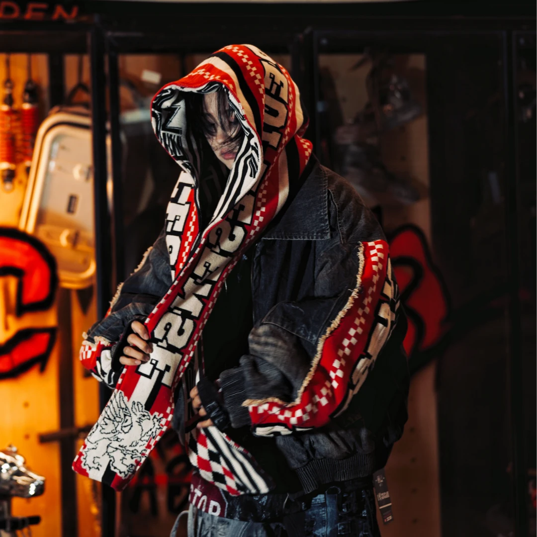 Sanhoostudio padded denim jacket featuring heavyweight washed denim, distressed graffiti artwork, hand-painted detailing, and asymmetric patchwork construction. Designed with a relaxed oversized silhouette and insulated padding for winter streetwear styling, comfortable warmth, and deconstructed visual appeal.