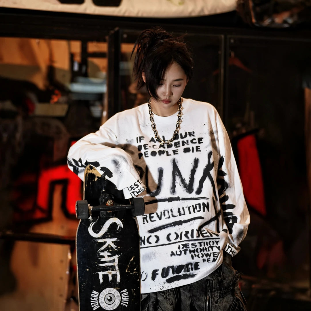 Sanhoostudio long sleeve T-shirt featuring ink wash-inspired graffiti artwork, spray print detailing, and a relaxed oversized silhouette. Designed for contemporary streetwear styling with soft breathable fabric, bold artistic textures, comfortable everyday wear, and versatile urban appeal.