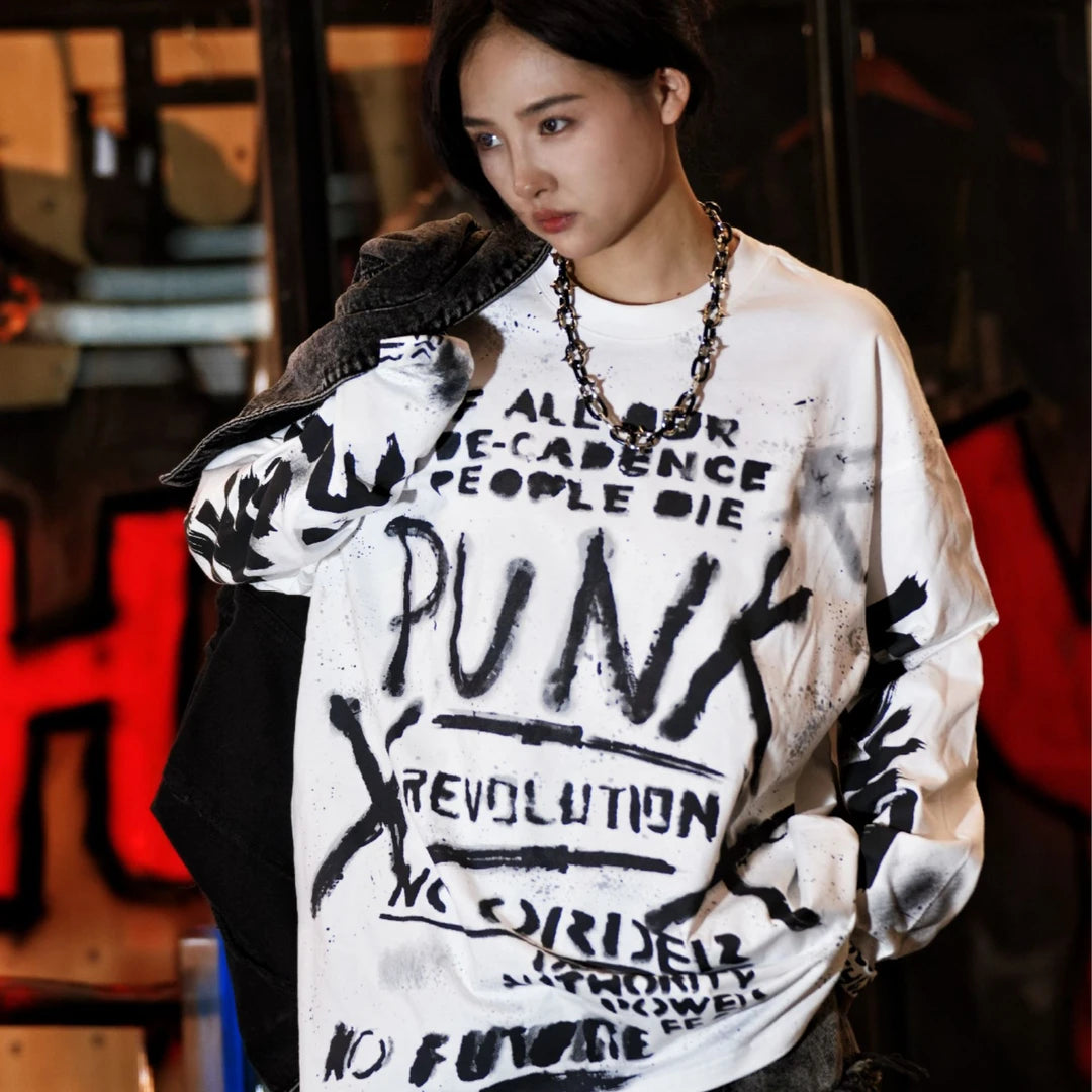 Sanhoostudio long sleeve T-shirt featuring ink wash-inspired graffiti artwork, spray print detailing, and a relaxed oversized silhouette. Designed for contemporary streetwear styling with soft breathable fabric, bold artistic textures, comfortable everyday wear, and versatile urban appeal.