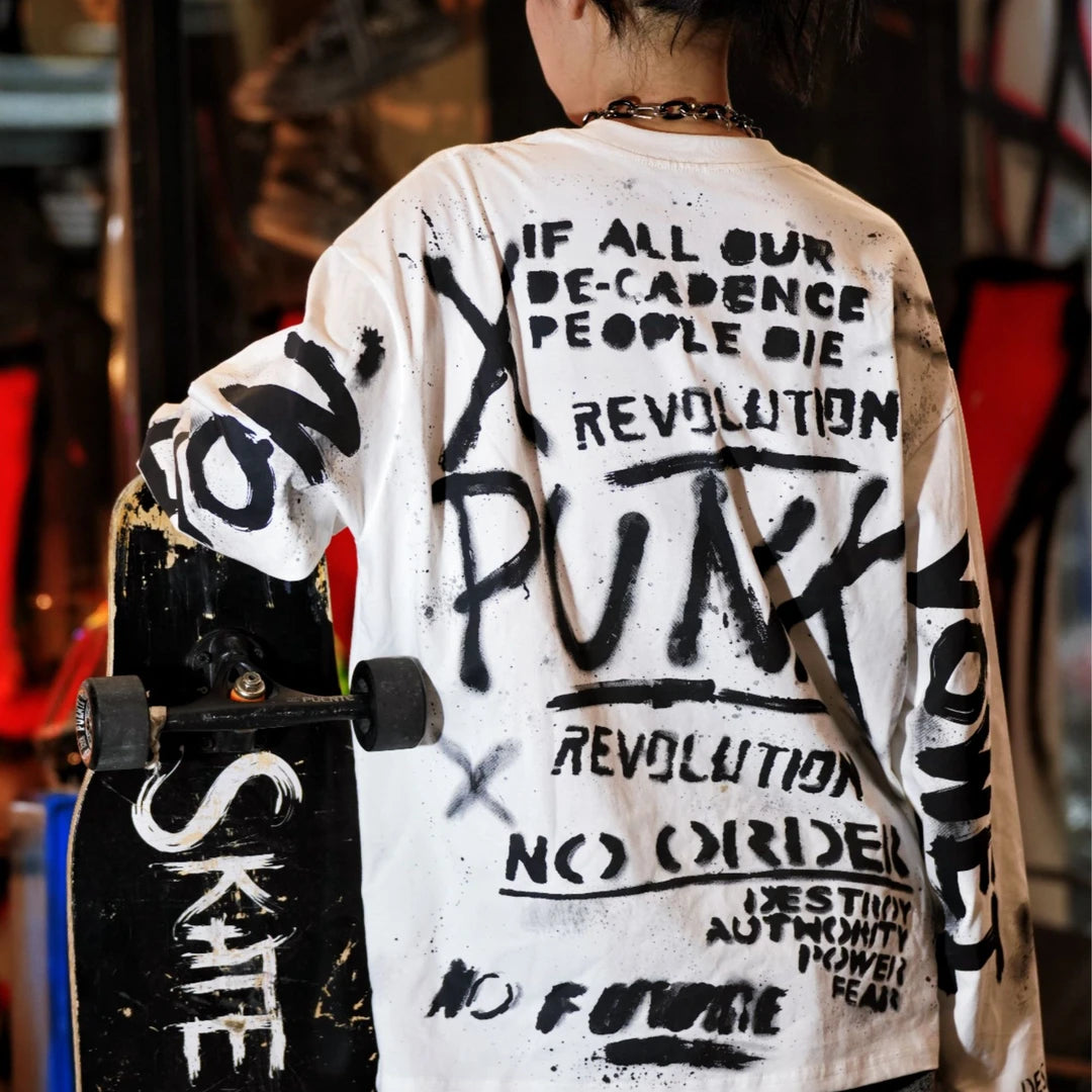 Sanhoostudio long sleeve T-shirt featuring ink wash-inspired graffiti artwork, spray print detailing, and a relaxed oversized silhouette. Designed for contemporary streetwear styling with soft breathable fabric, bold artistic textures, comfortable everyday wear, and versatile urban appeal.