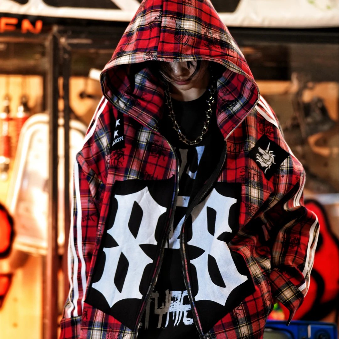 Sanhoostudio fleece-lined jacket featuring red plaid-inspired graphic detailing, digital print artwork, patchwork construction, and a relaxed oversized silhouette. Designed for fall and winter streetwear styling with comfortable warmth, distinctive contrasting textures, versatile layering, and bold contemporary appeal.