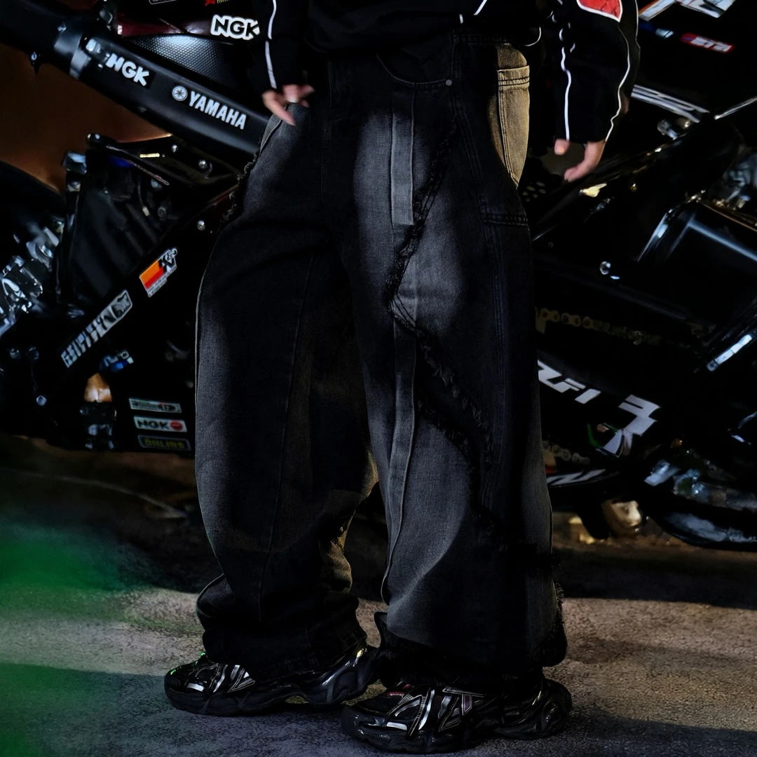 Sanhoostudio denim pants featuring heavyweight black denim, vintage washed treatment, and an oversized wide leg silhouette with an extended floor-length cut. Designed for contemporary American streetwear styling with rugged denim texture, relaxed proportions, comfortable everyday wear, and effortless urban appeal.
