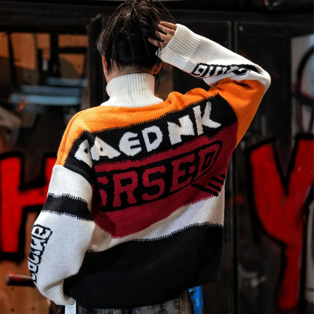 Sanhoostudio knit sweater featuring Suzuki-inspired colorblock detailing, heavyweight knitted construction, distressed graffiti artwork, and hand-painted patchwork elements. Designed with a relaxed oversized silhouette for statement streetwear styling, distinctive racing-inspired aesthetics, comfortable warmth, and bol