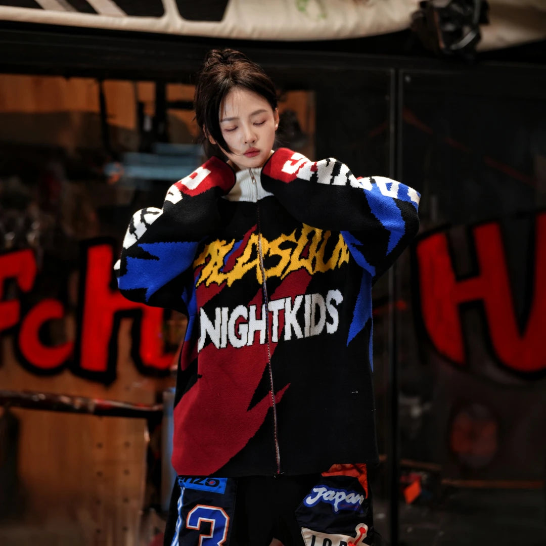 Sanhoostudio knit sweater featuring thunder-inspired contrasting colors, heavyweight knitted construction, distressed graffiti artwork, and hand-painted patchwork detailing. Designed for statement streetwear styling with a relaxed oversized silhouette, bold color combinations, comfortable warmth, and distinctive appeal