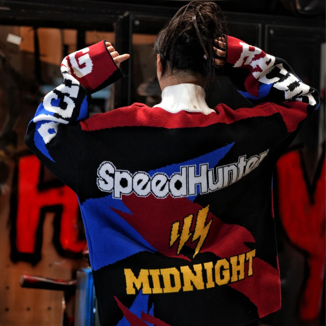 Sanhoostudio knit sweater featuring thunder-inspired contrasting colors, heavyweight knitted construction, distressed graffiti artwork, and hand-painted patchwork detailing. Designed for statement streetwear styling with a relaxed oversized silhouette, bold color combinations, comfortable warmth, and distinctive appeal