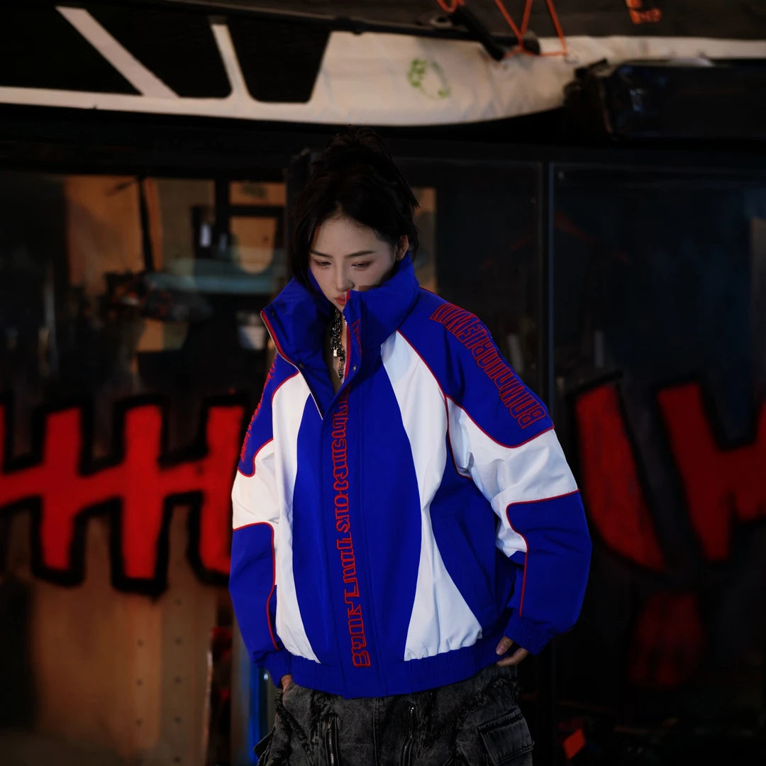 Sanhoostudio down jacket featuring handcrafted distressed detailing, stain-effect textures, a structured stand collar, and a cropped oversized silhouette. Designed for winter streetwear styling with comfortable insulation, bold racing-inspired aesthetics, relaxed proportions, and distinctive vintage-inspired character.