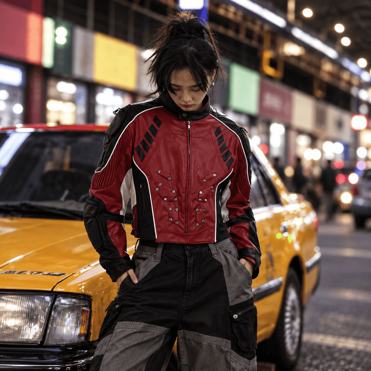 Sanhoostudio PU leather racing jacket featuring contrast patchwork panels, structured padded shoulders, and a bold motorcycle-inspired silhouette. Designed for statement streetwear styling with vintage motorsport influence, strong visual structure, and comfortable everyday layering.