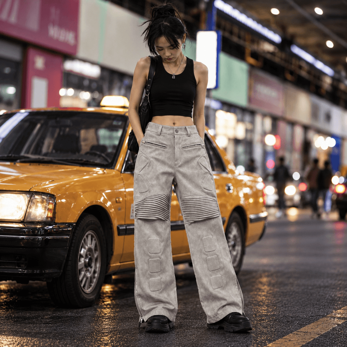 Sanhoostudio PU leather pants featuring exoskeleton-inspired structural detailing, distressed texture, subtle wrinkling, and a relaxed straight-leg silhouette. Designed for motorcycle and streetwear styling with bold construction, comfortable movement, and futuristic urban character.