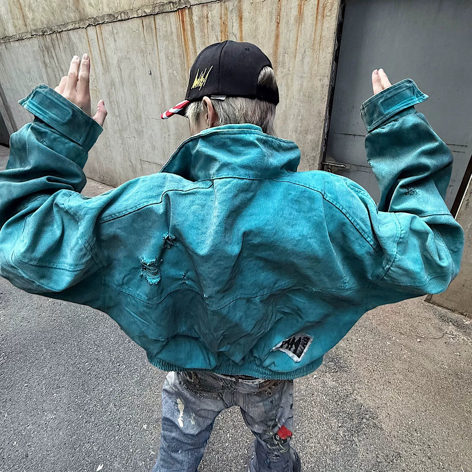 Sanhoostudio vintage-inspired canvas jacket crafted from 100% cotton. Featuring patchwork distressing, dyed finish, and a structured oversized fit that defines modern denim street style for all genders.