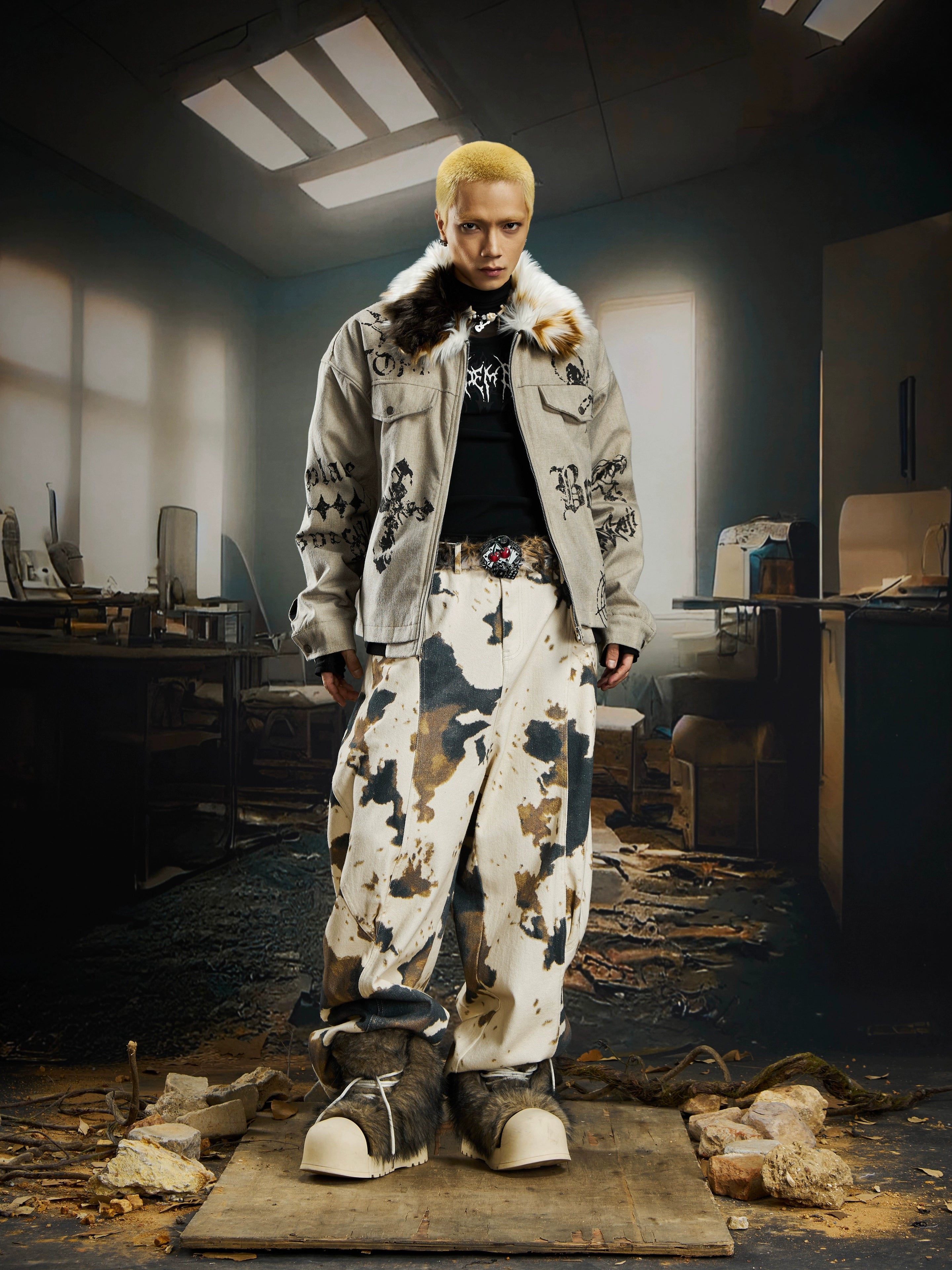 A dark punk-style padded jacket with gothic prints and a soft fur collar. Sanhoostudio’s signature street attitude meets warm winter protection.