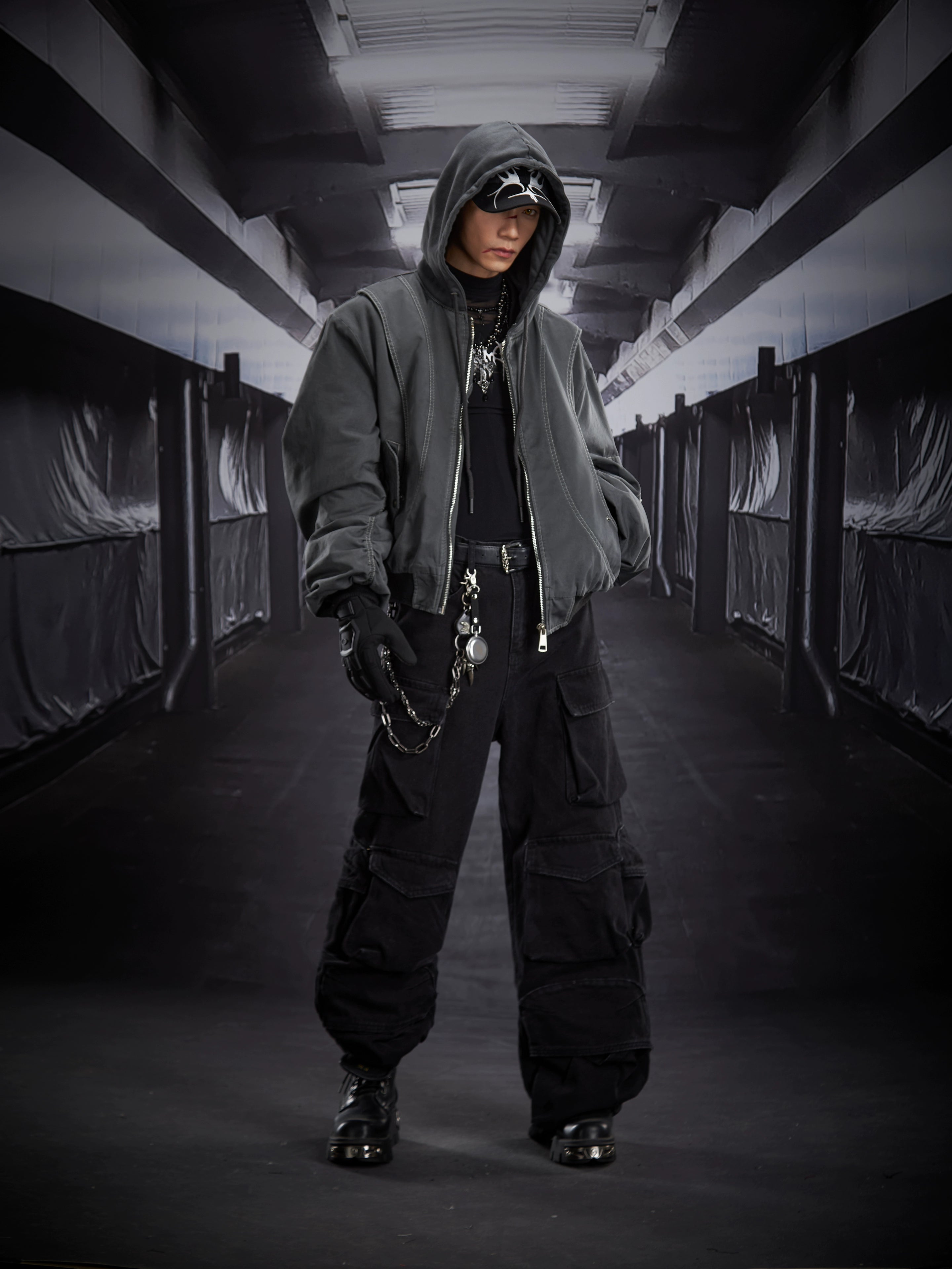 A versatile deconstructed utility puffer jacket with a hooded zip design, warm padding, and a relaxed cropped fit. Crafted by Sanhoostudio for a bold streetwear winter look.