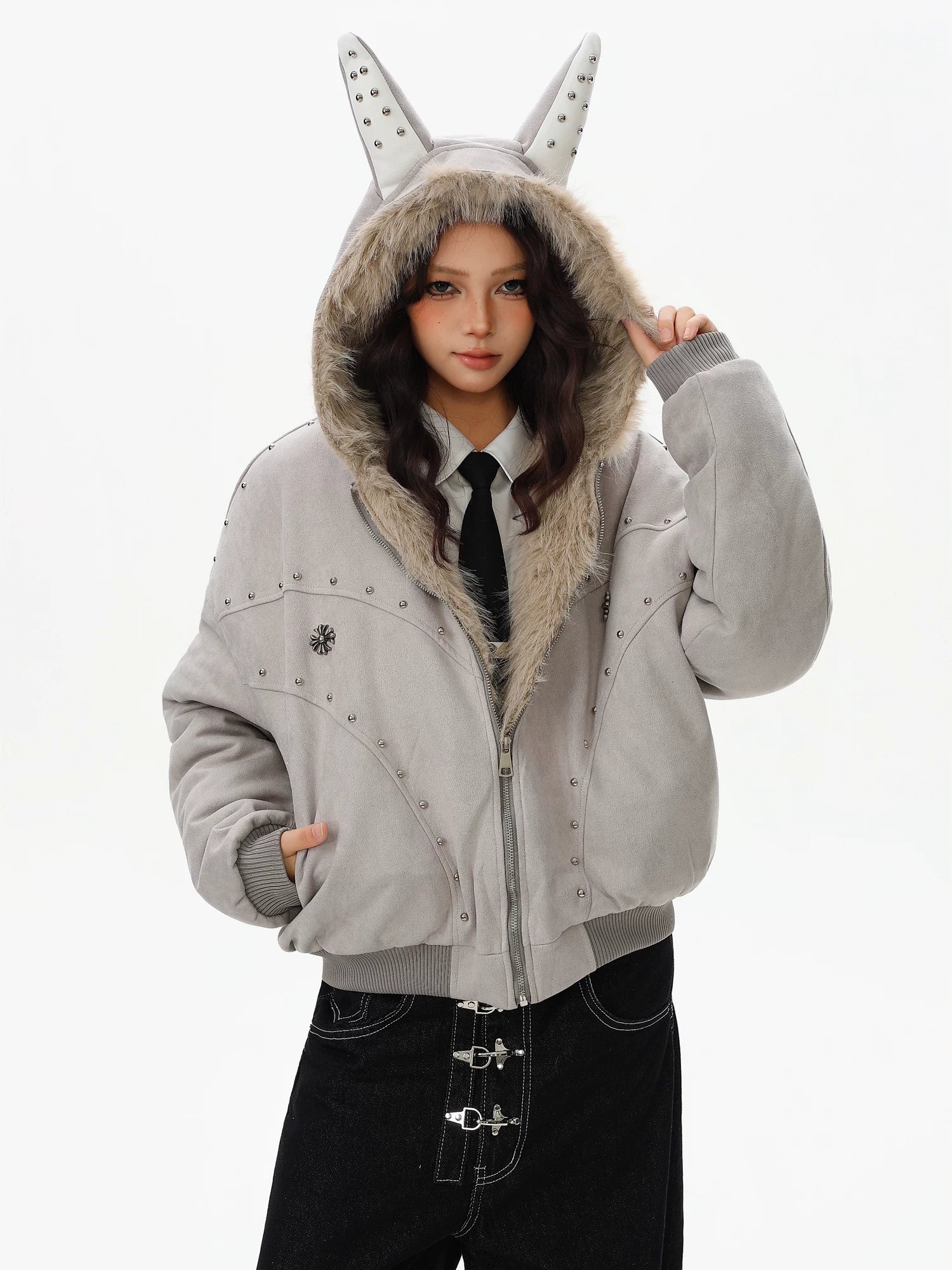 Sanhoostudio padded jacket with fur collar and hooded design, featuring mountain eagle detailing and stud accents. Built for warmth with a structured streetwear silhouette for winter styling.