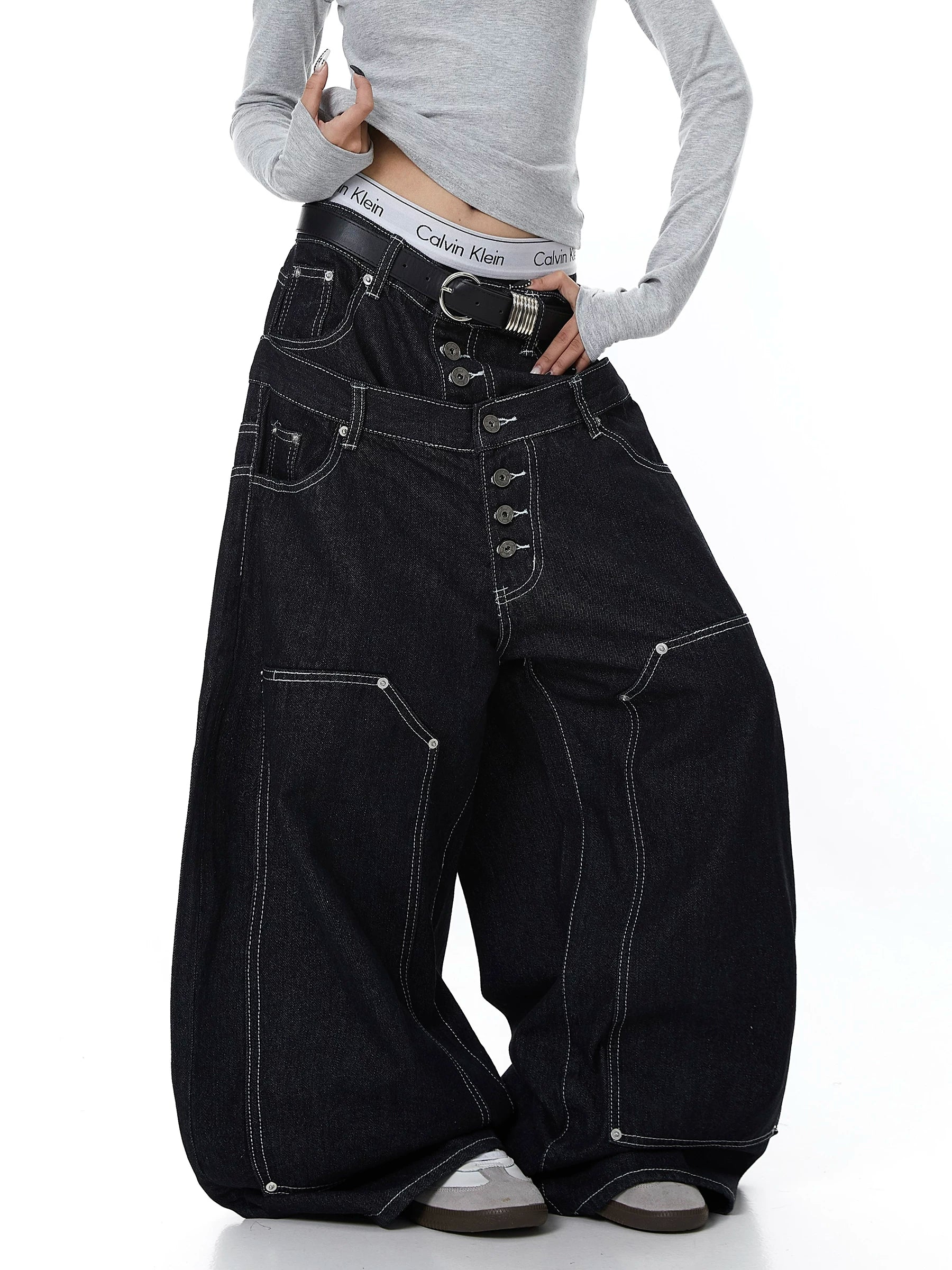 Sanhoostudio denim pants featuring double waistband design, exposed stitching, and button details. Built with a wide leg silhouette for high street styling.