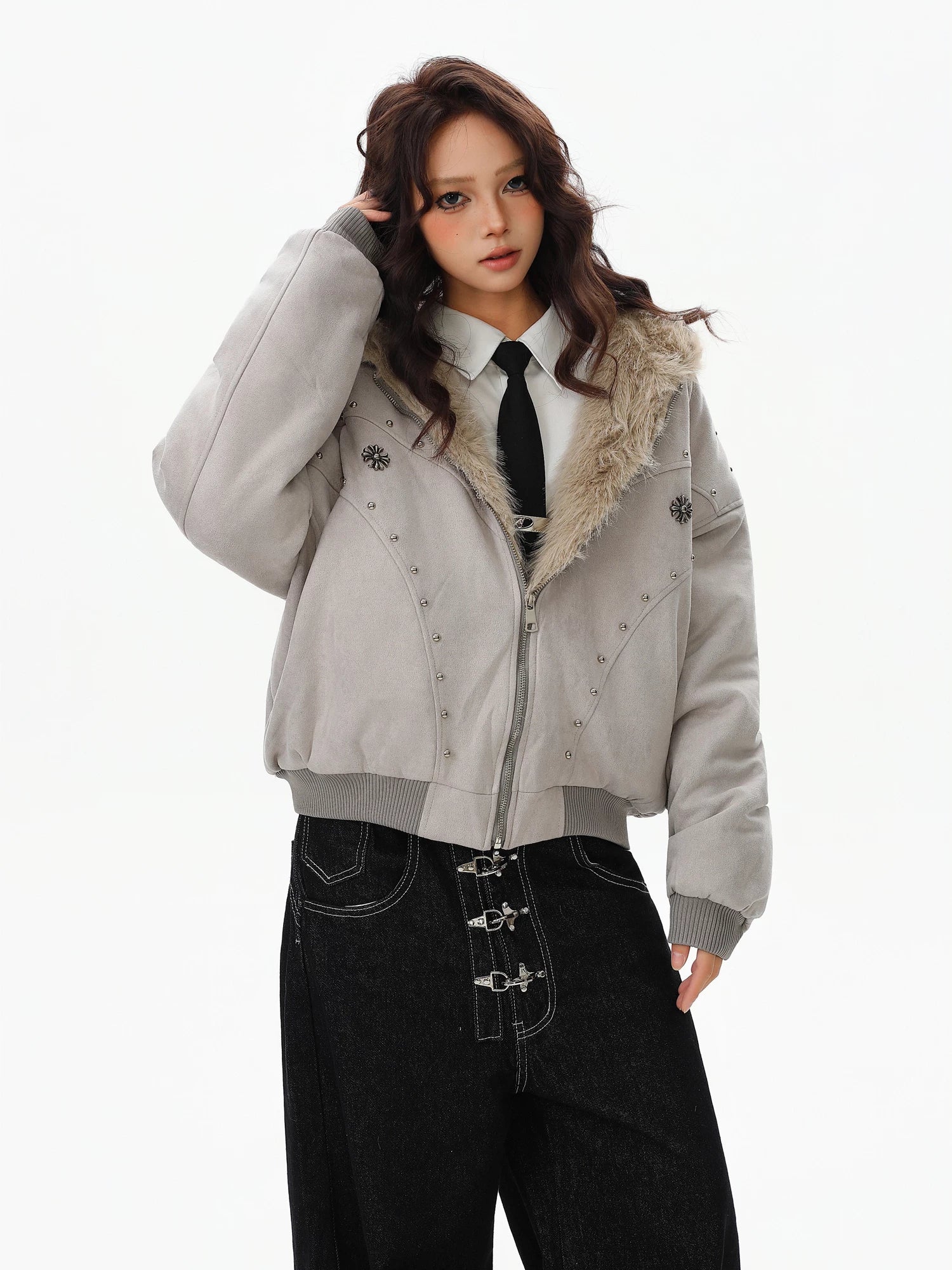 Sanhoostudio padded jacket with fur collar and hooded design, featuring mountain eagle detailing and stud accents. Built for warmth with a structured streetwear silhouette for winter styling.