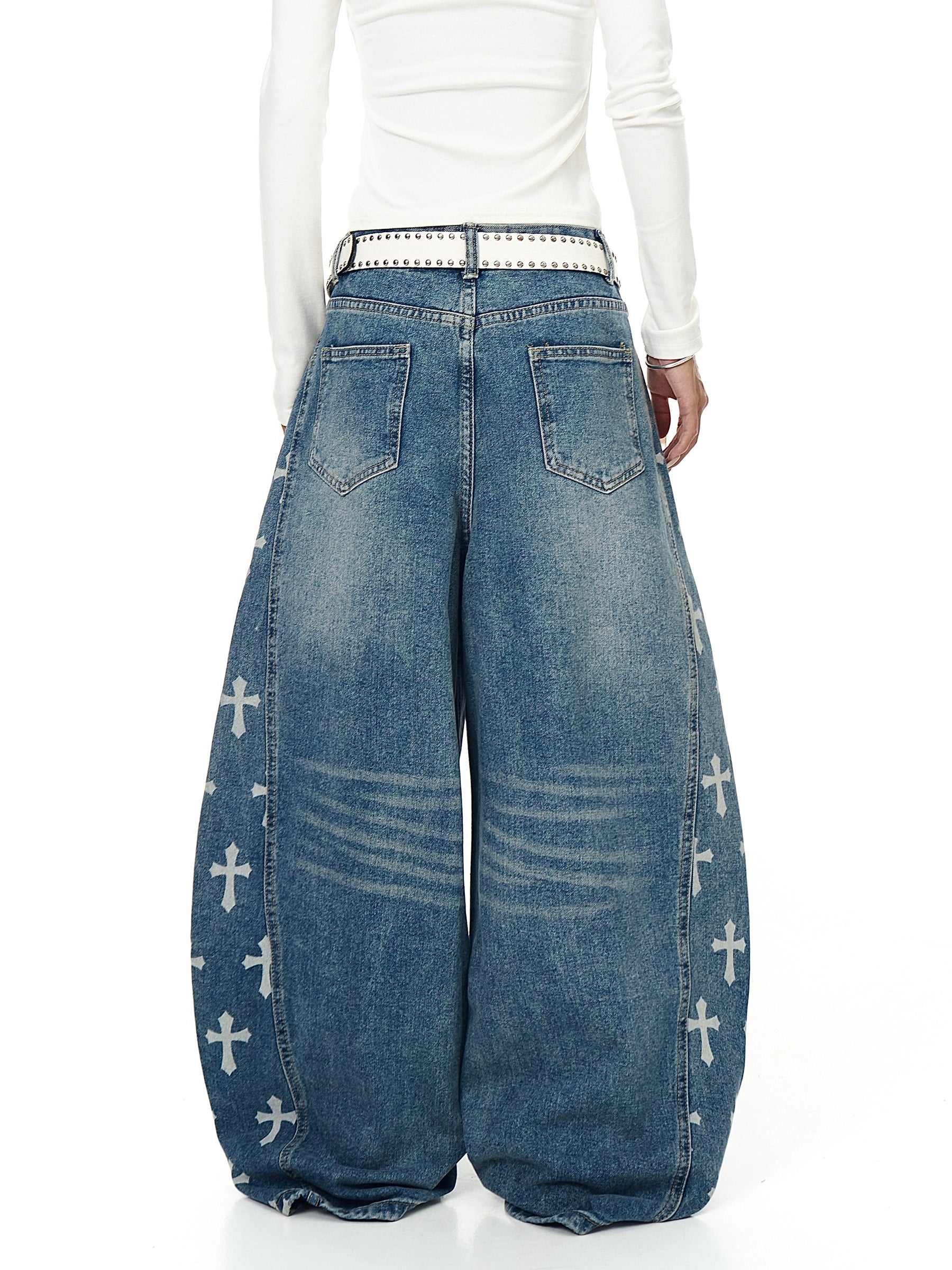 An icon of gothic rebellion — cross-printed denim with a relaxed wide-leg silhouette. Designed for high-street dreamers and underground believers by SanhooStudio.