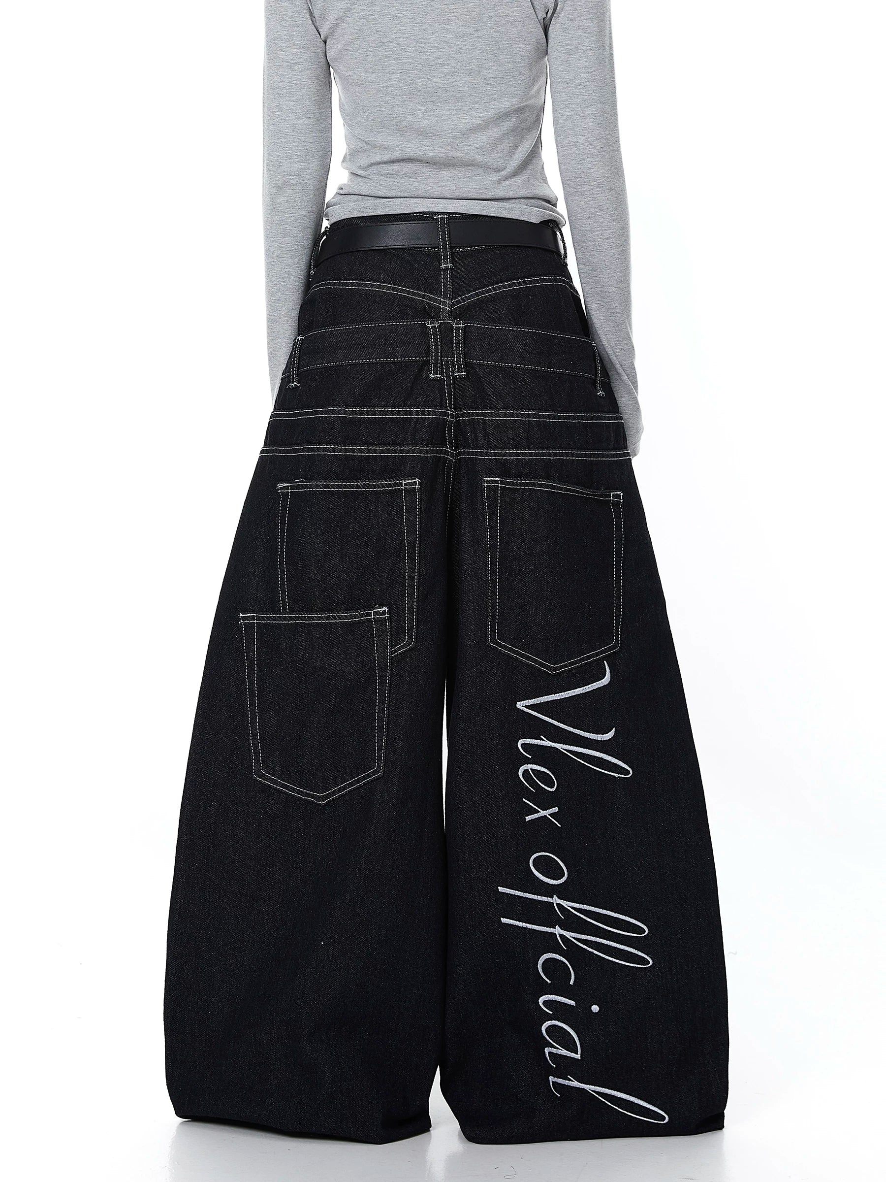 Sanhoostudio denim pants featuring double waistband design, exposed stitching, and button details. Built with a wide leg silhouette for high street styling.