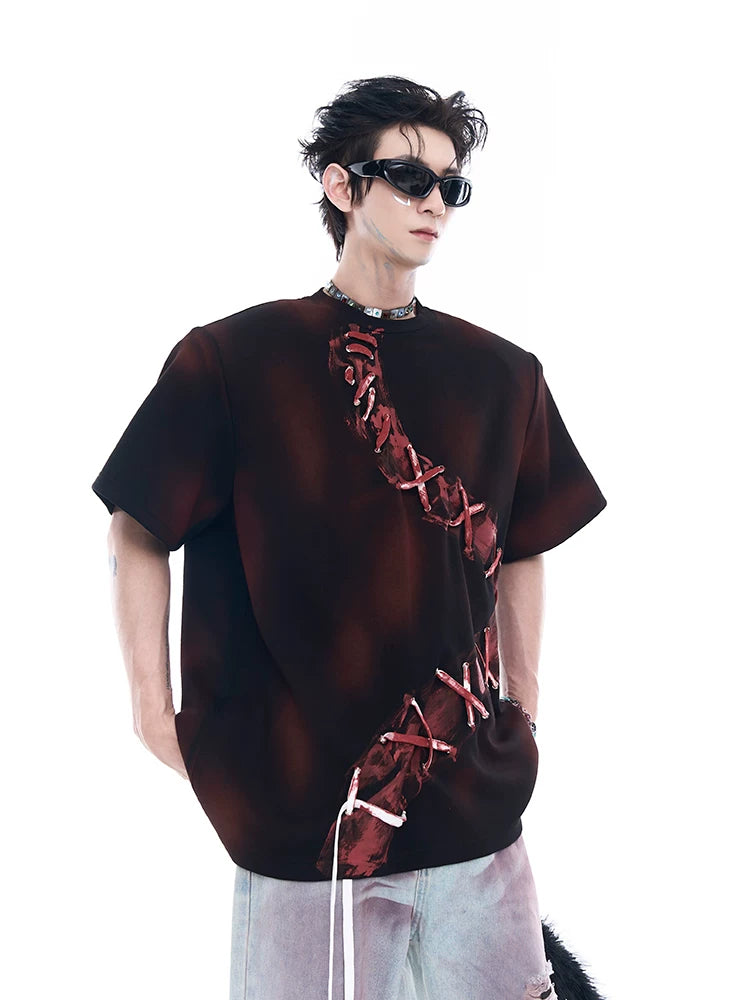 Sanhoostudio dark red T-shirt featuring spray dye effect and lace-up design. A unique streetwear piece combining bold color and artistic detailing.