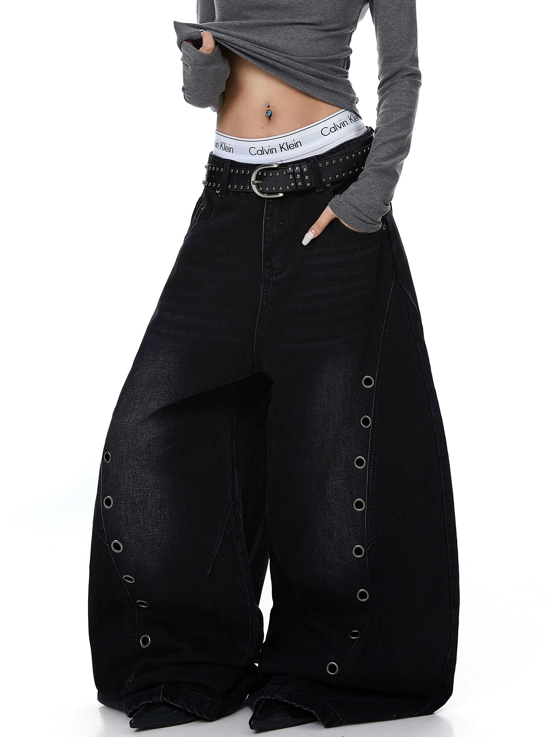 Sanhoostudio wide leg denim pants featuring cut-out structure and metal ring details. A bold deconstructed streetwear piece with distressed finish.