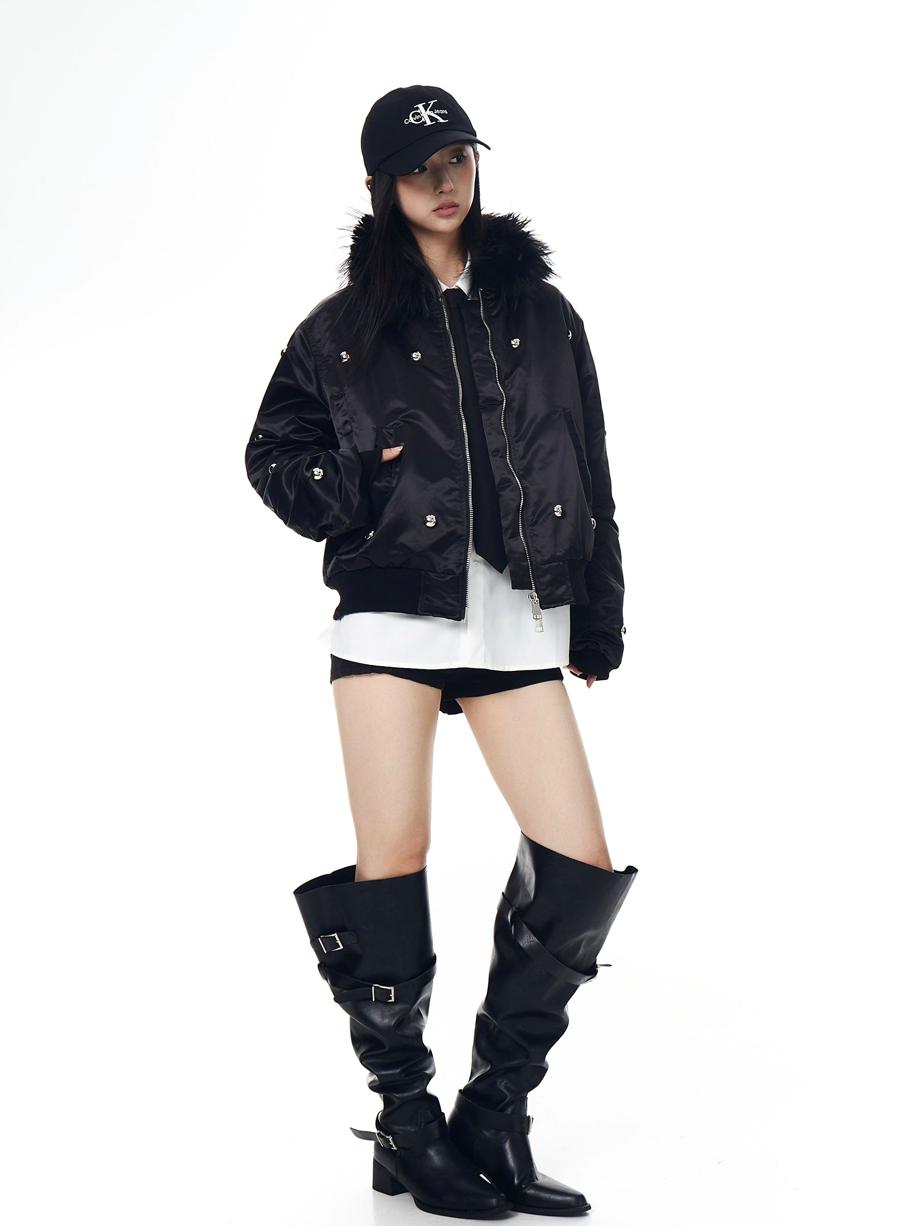 A heavy aviator-style puffer with metal studs, a warm fur collar, and high-street visual impact. Thick, bold, and unisex—perfect for winter street statements. Sanhoostudio exclusive.