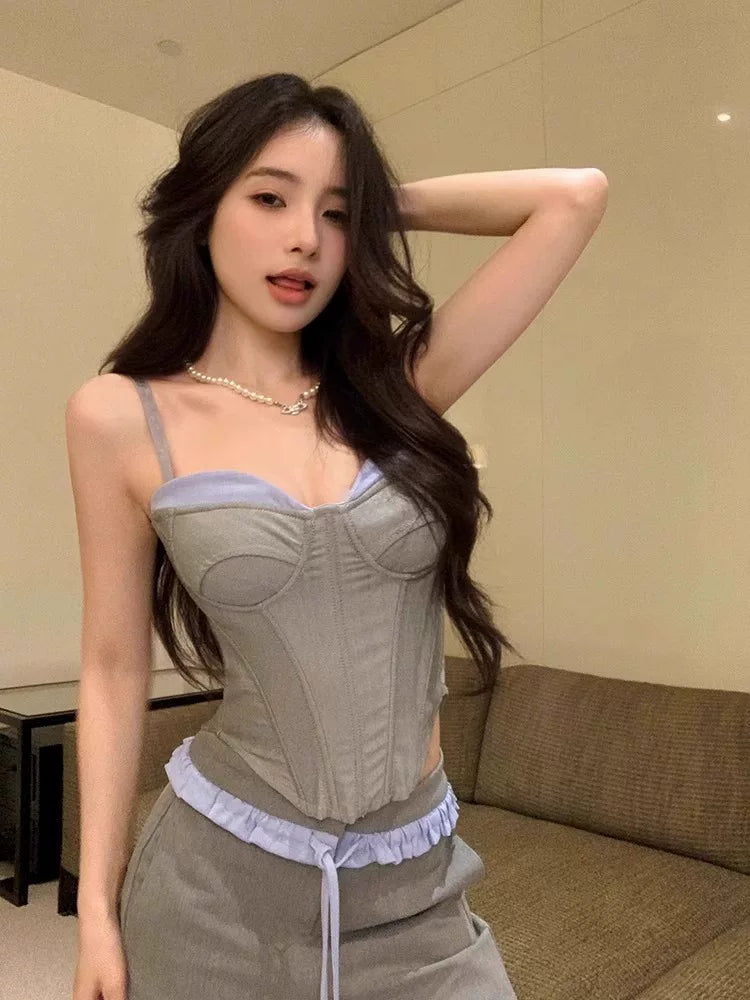 Sanhoostudio halter camisole top designed with a ribbed structure and built-in padding. A versatile piece for layering or standalone streetwear looks.