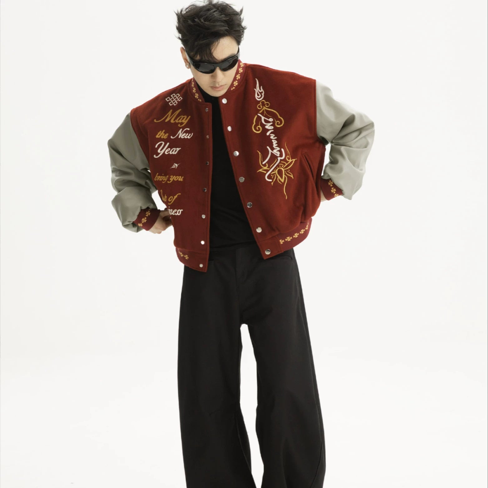 Sanhoostudio varsity jacket with patchwork construction and embroidery. A unisex retro-inspired streetwear outerwear piece.