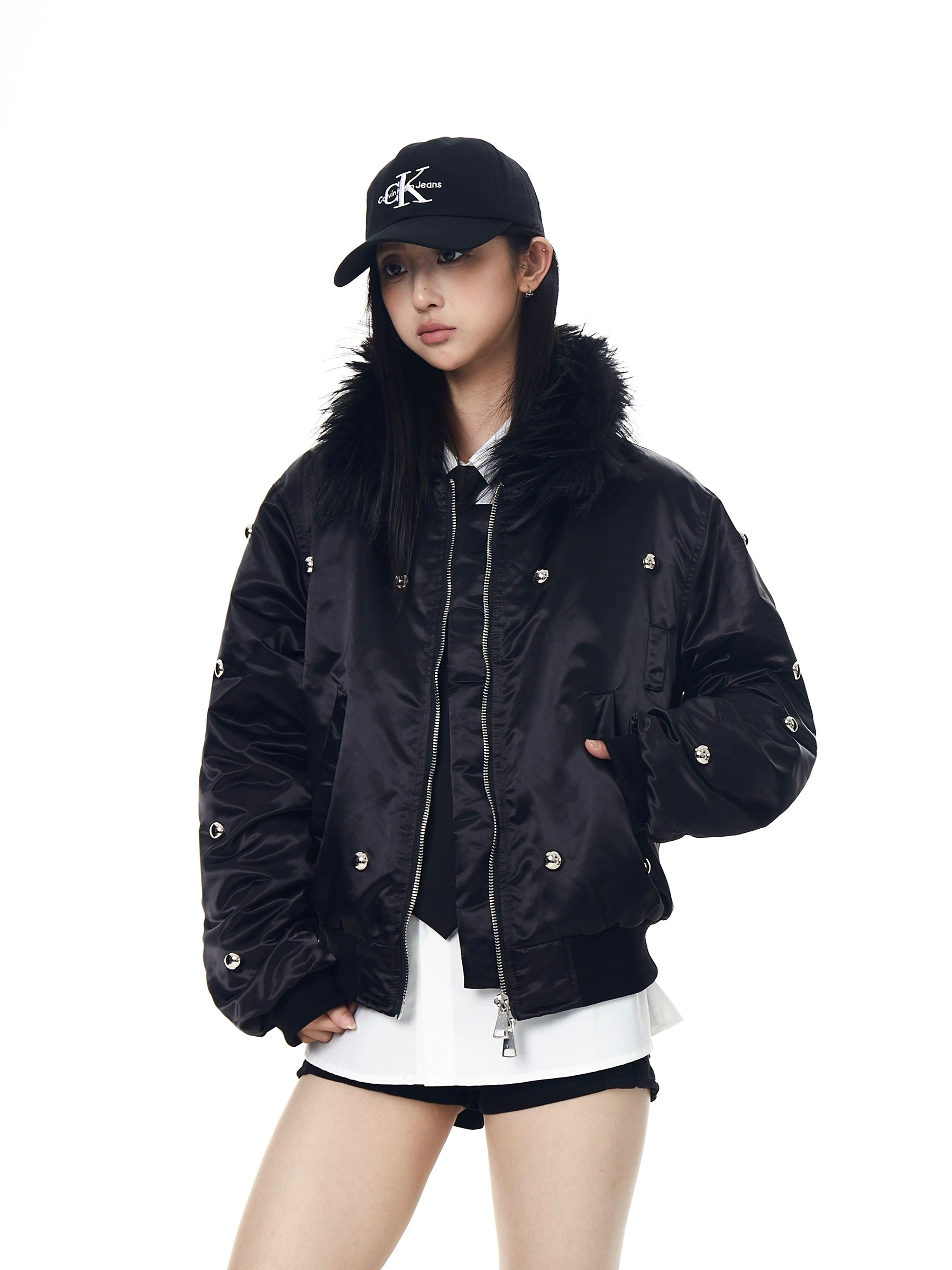 A heavy aviator-style puffer with metal studs, a warm fur collar, and high-street visual impact. Thick, bold, and unisex—perfect for winter street statements. Sanhoostudio exclusive.