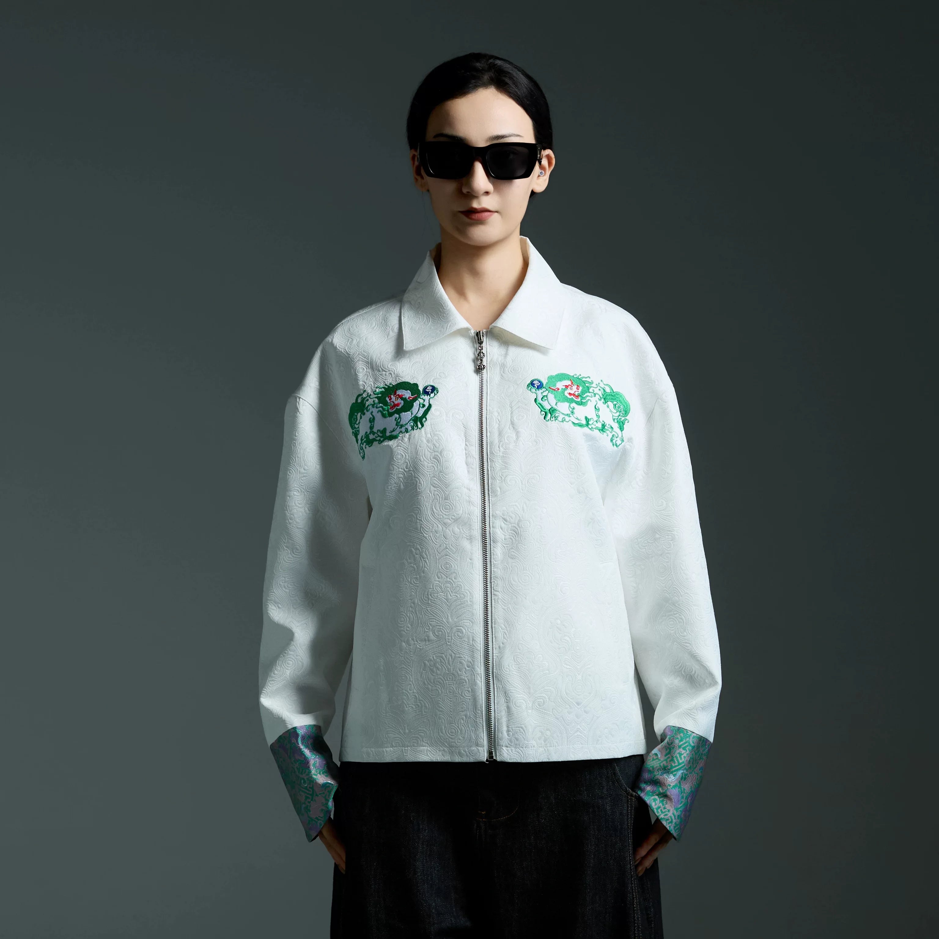 Sanhoostudio embroidered jacket with Tibetan snow lion graphics. A relaxed unisex streetwear piece designed for casual daily wear.