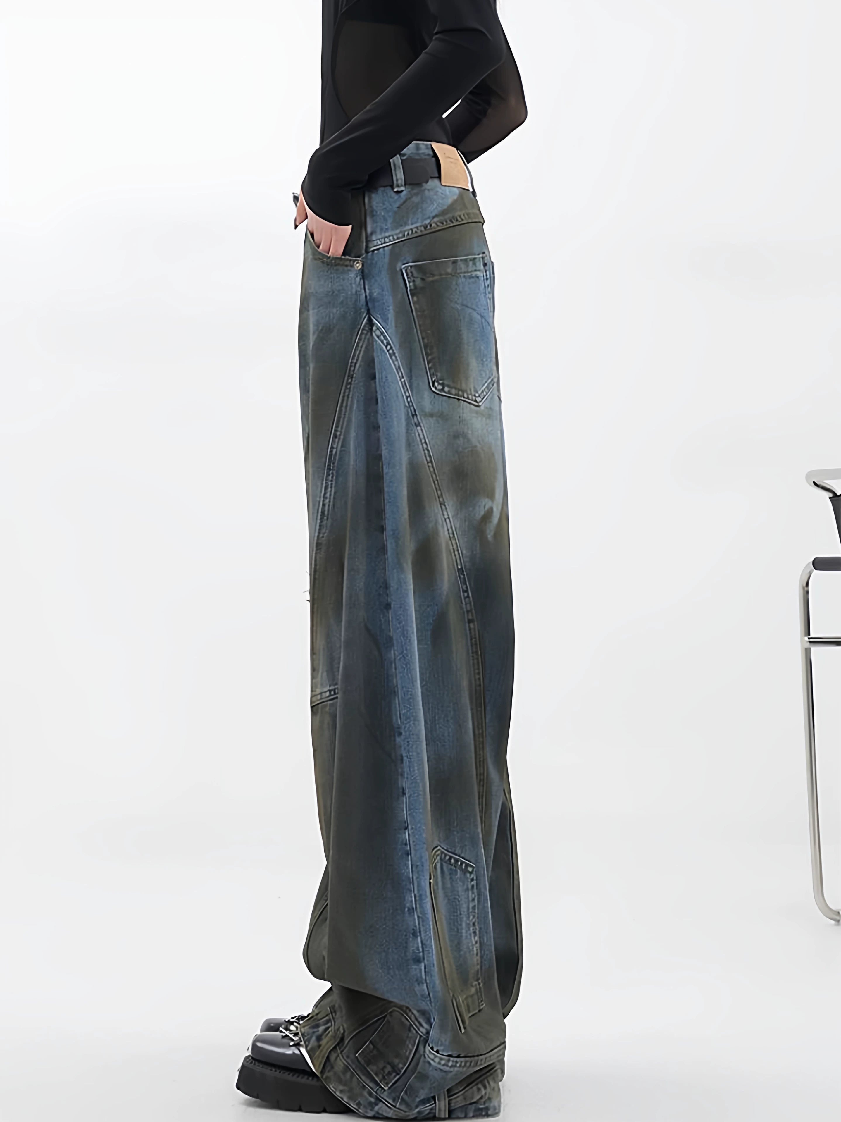 Sanhoostudio wide leg jeans featuring reverse panel construction and distressed details. A high street denim piece with bold design character.