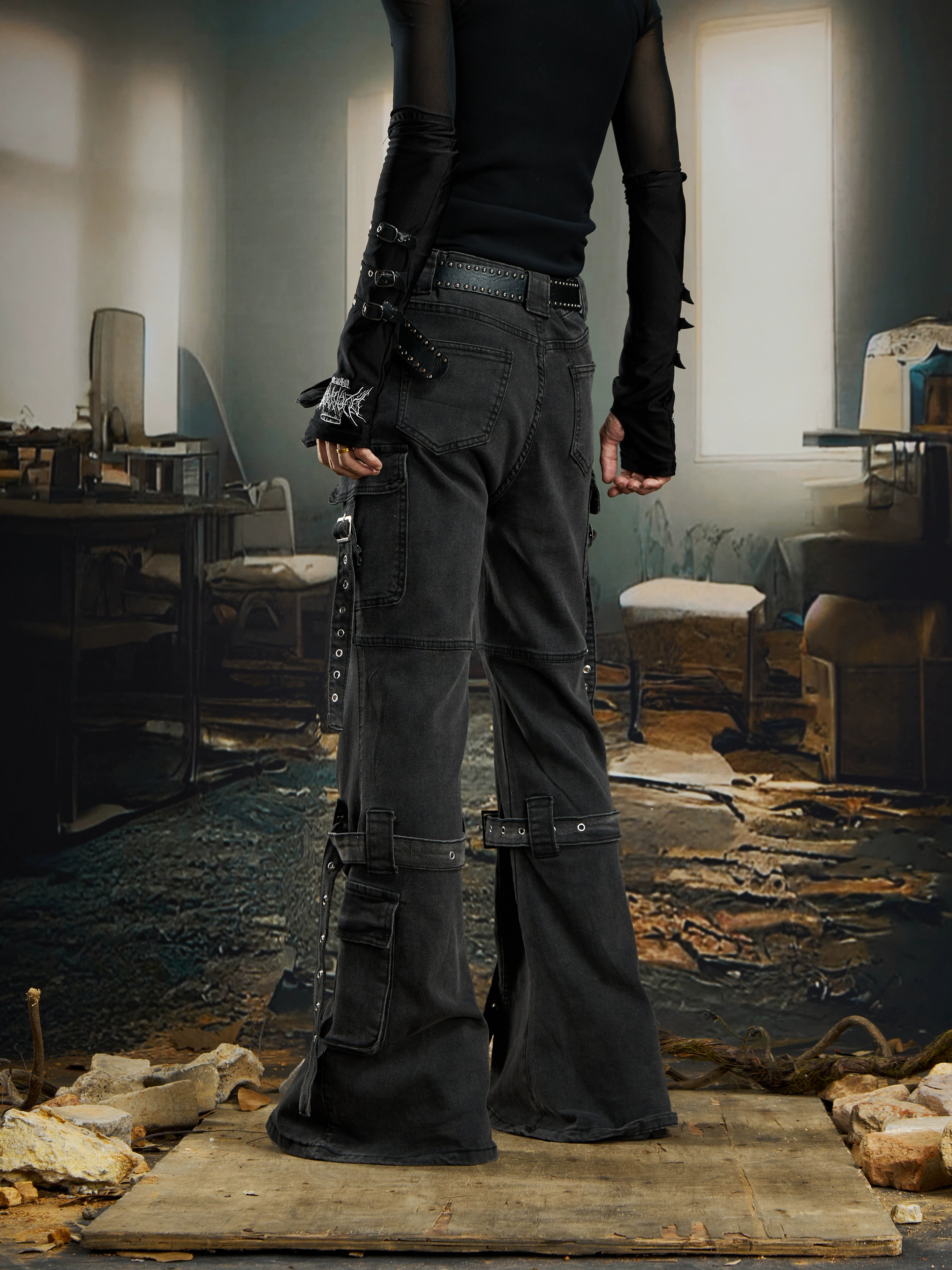 A Y2K-inspired deconstructed jean with ribbon panels and a subtle flare silhouette. Sanhoostudio’s signature dark street individuality.