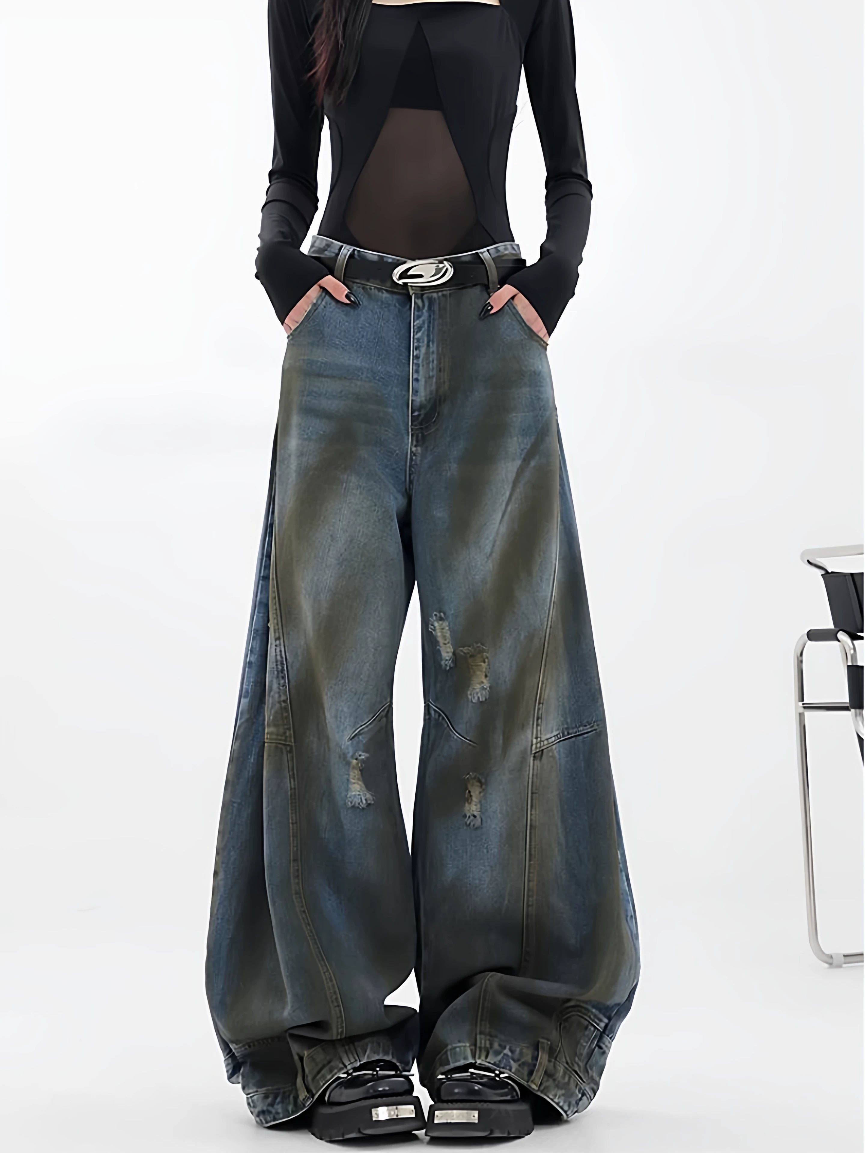 Sanhoostudio wide leg jeans featuring reverse panel construction and distressed details. A high street denim piece with bold design character.