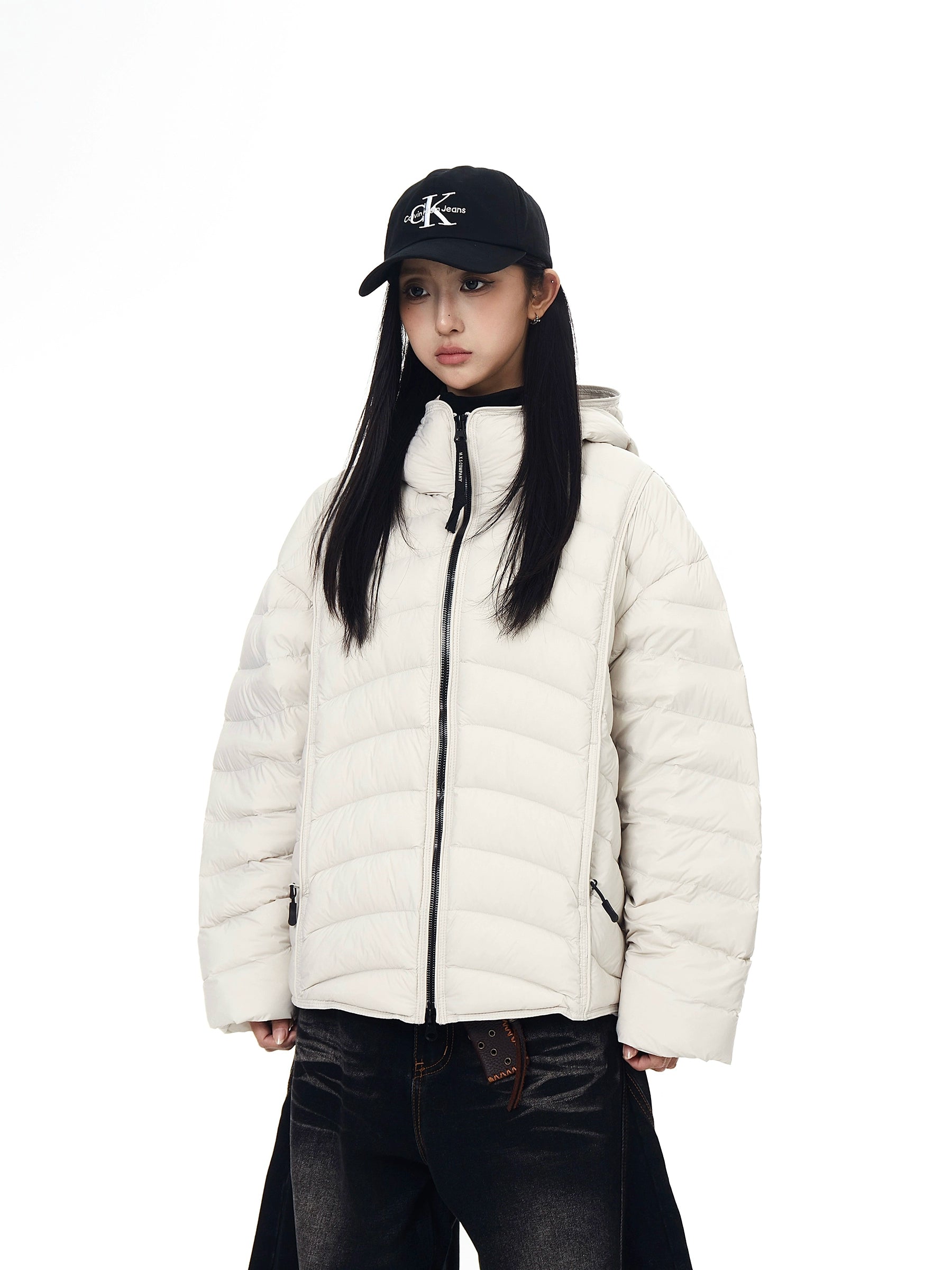 A premium 90% white-duck-down puffer coat featuring ribbed shell stitching and a protective hooded design. Ultra-warm, unisex, and built for winter street style. Only at Sanhoostudio.