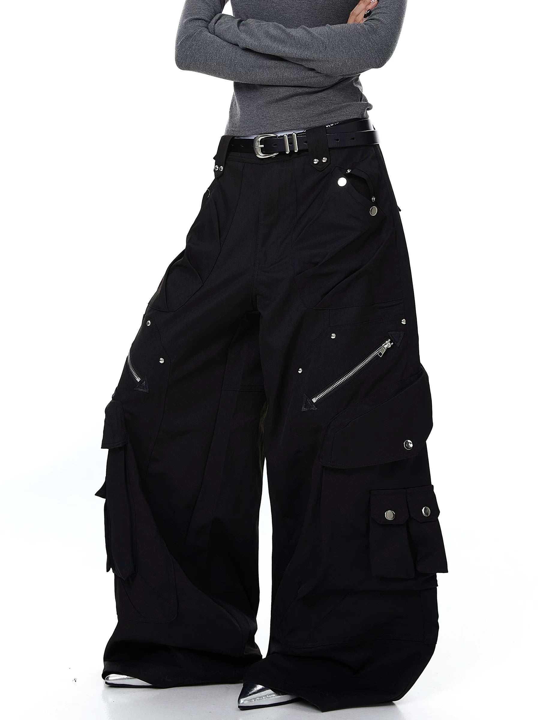 Sanhoostudio cargo pants featuring heavy utility construction, stud details, and multi-pocket design. Built with a wide leg silhouette for bold streetwear outfits.