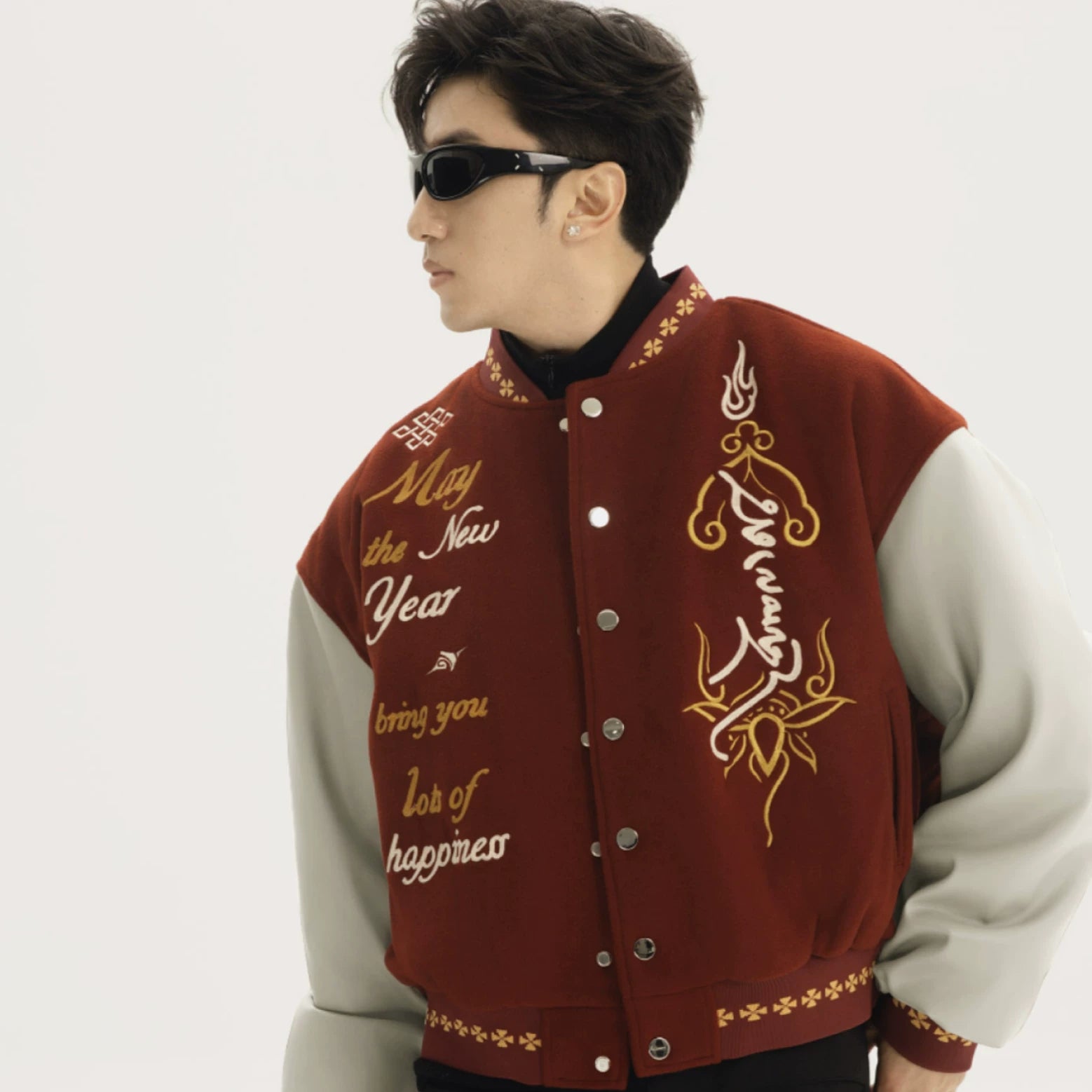 Sanhoostudio varsity jacket with patchwork construction and embroidery. A unisex retro-inspired streetwear outerwear piece.