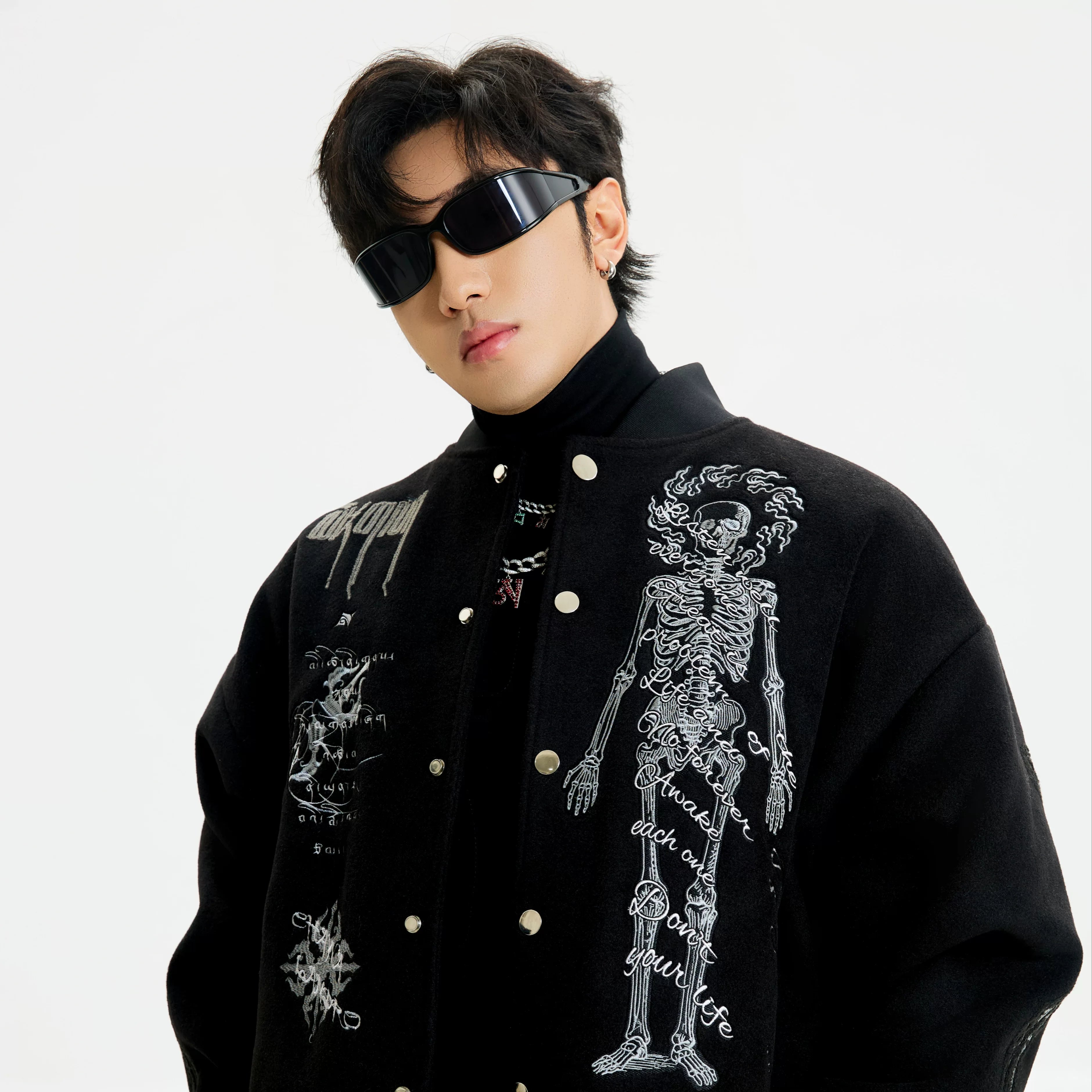 Sanhoostudio heavyweight varsity jacket with embroidery and warm construction. Designed for unisex winter streetwear.