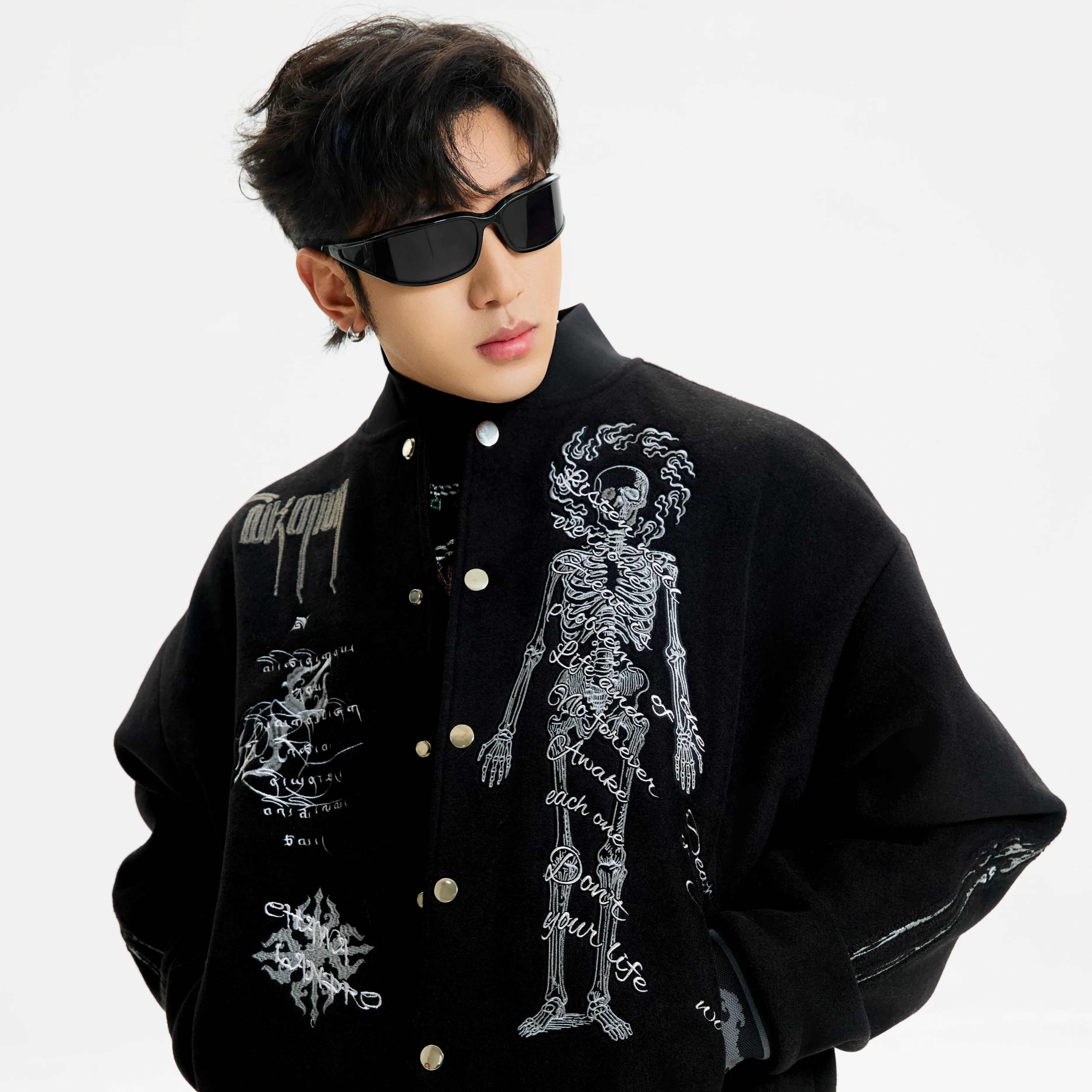 Sanhoostudio heavyweight varsity jacket with embroidery and warm construction. Designed for unisex winter streetwear.