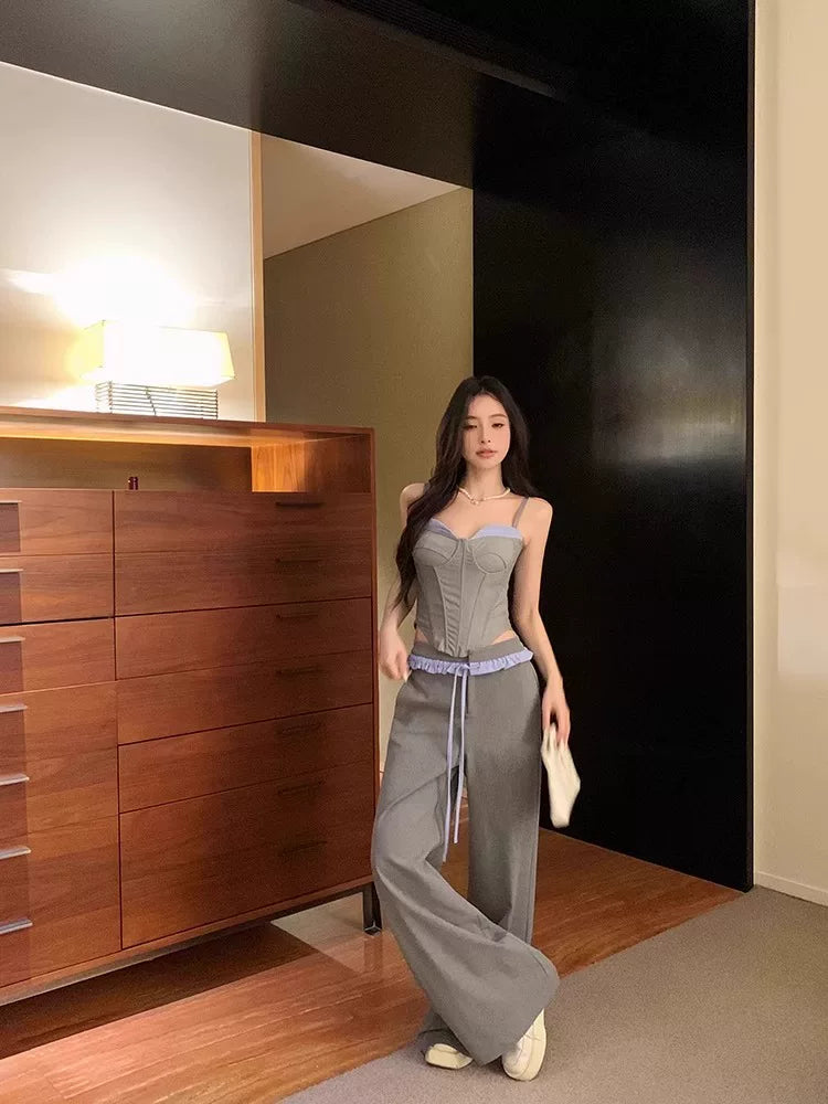 Sanhoostudio halter camisole top designed with a ribbed structure and built-in padding. A versatile piece for layering or standalone streetwear looks.