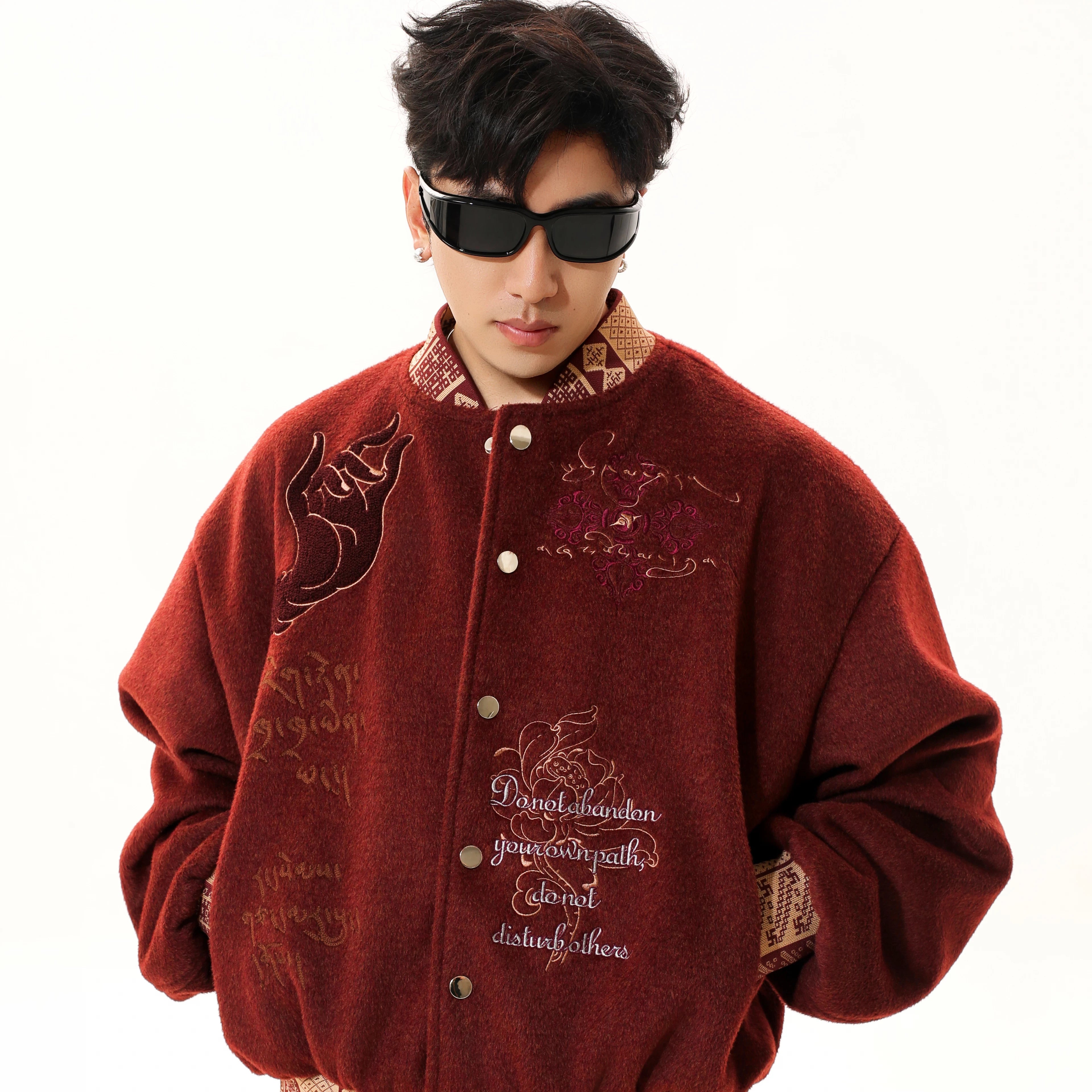 Sanhoostudio heavyweight varsity jacket with embroidered details. Designed for unisex fall streetwear and layering.