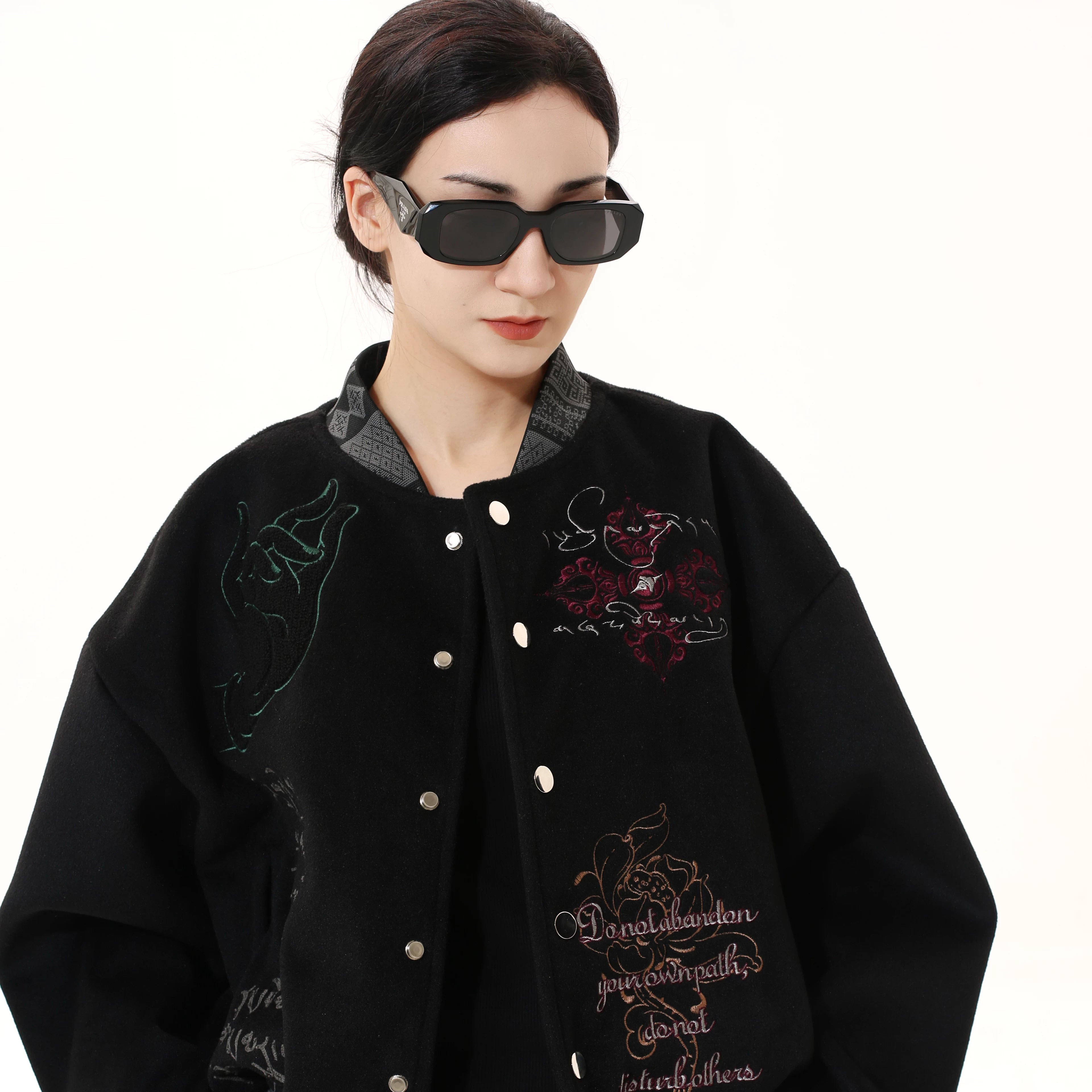 Sanhoostudio heavyweight varsity jacket with embroidered details. Designed for unisex fall streetwear and layering.