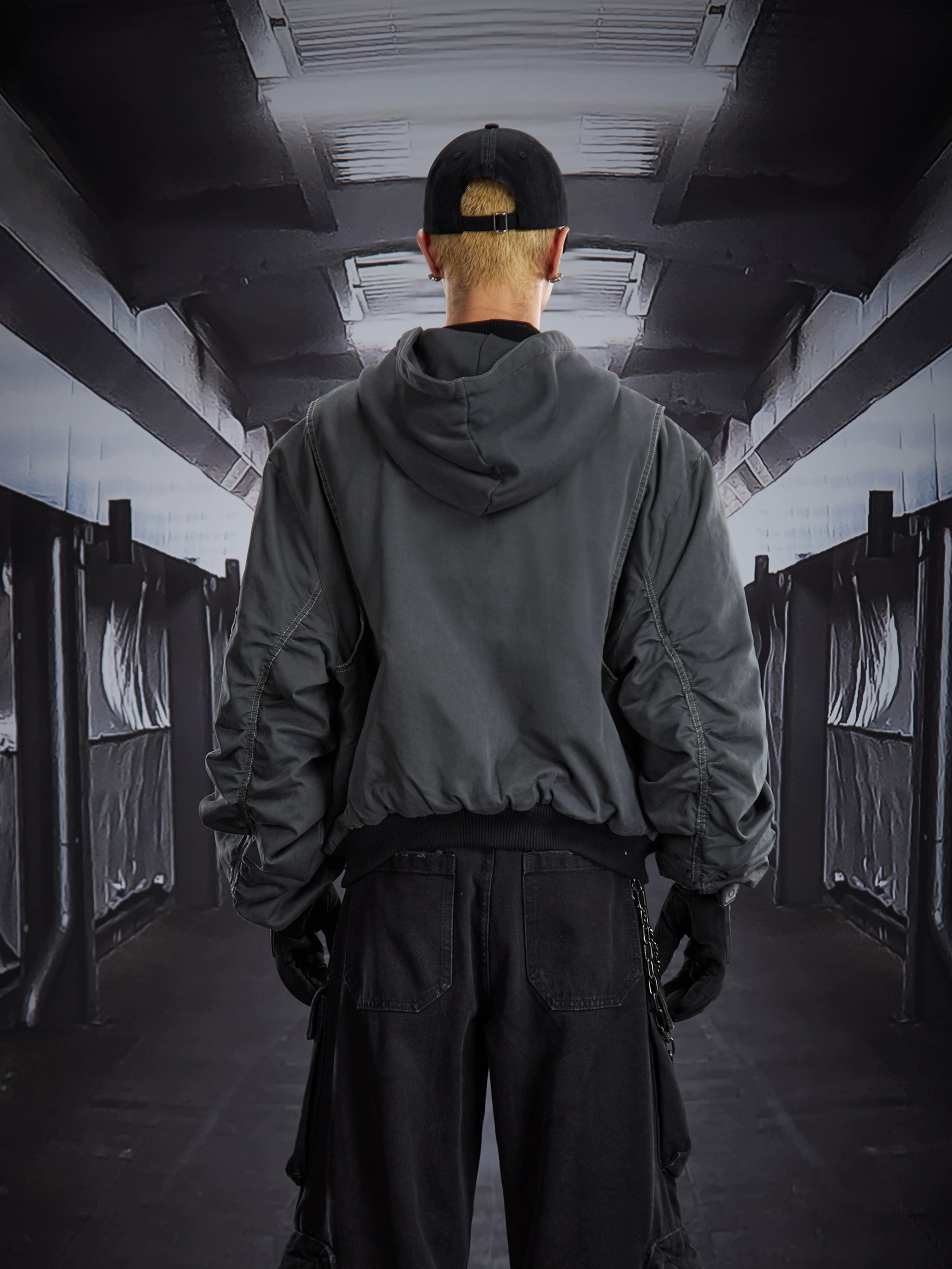 A versatile deconstructed utility puffer jacket with a hooded zip design, warm padding, and a relaxed cropped fit. Crafted by Sanhoostudio for a bold streetwear winter look.
