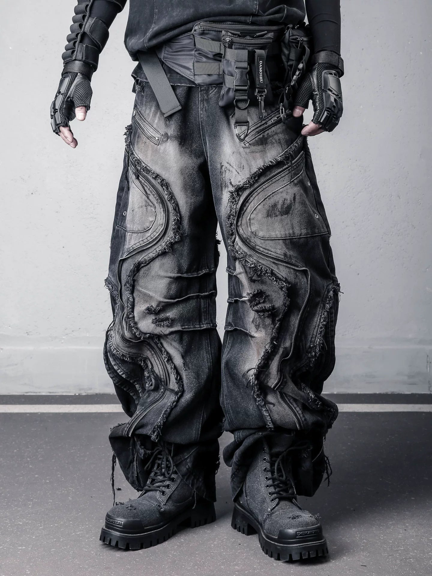 Sanhoostudio denim pants featuring fringe details, deconstructed design, and wide leg silhouette for standout streetwear outfits.