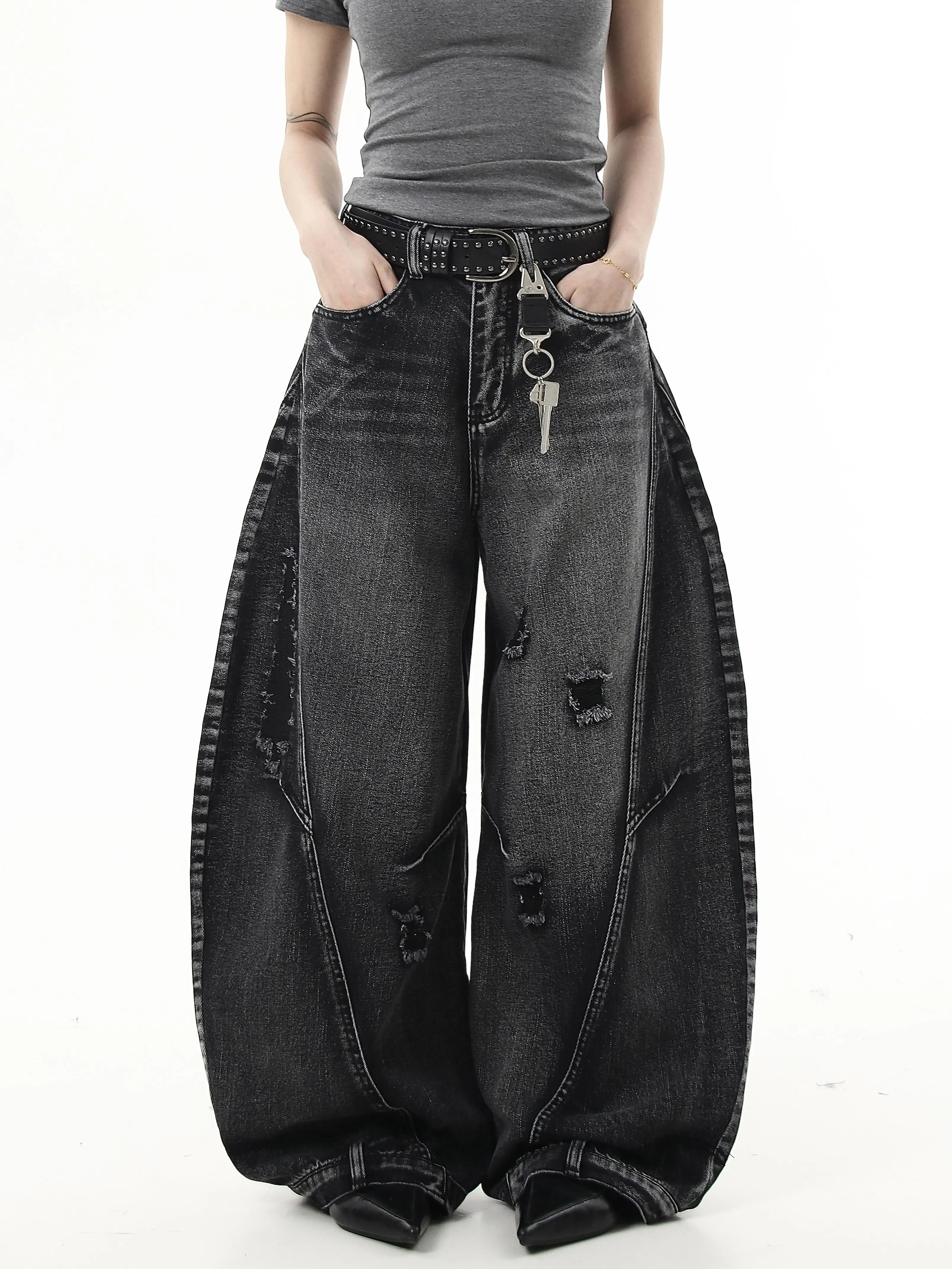 Sanhoostudio wide leg denim pants featuring washed distressing and ripped details. Designed with a curved scythe silhouette for modern high street fashion.