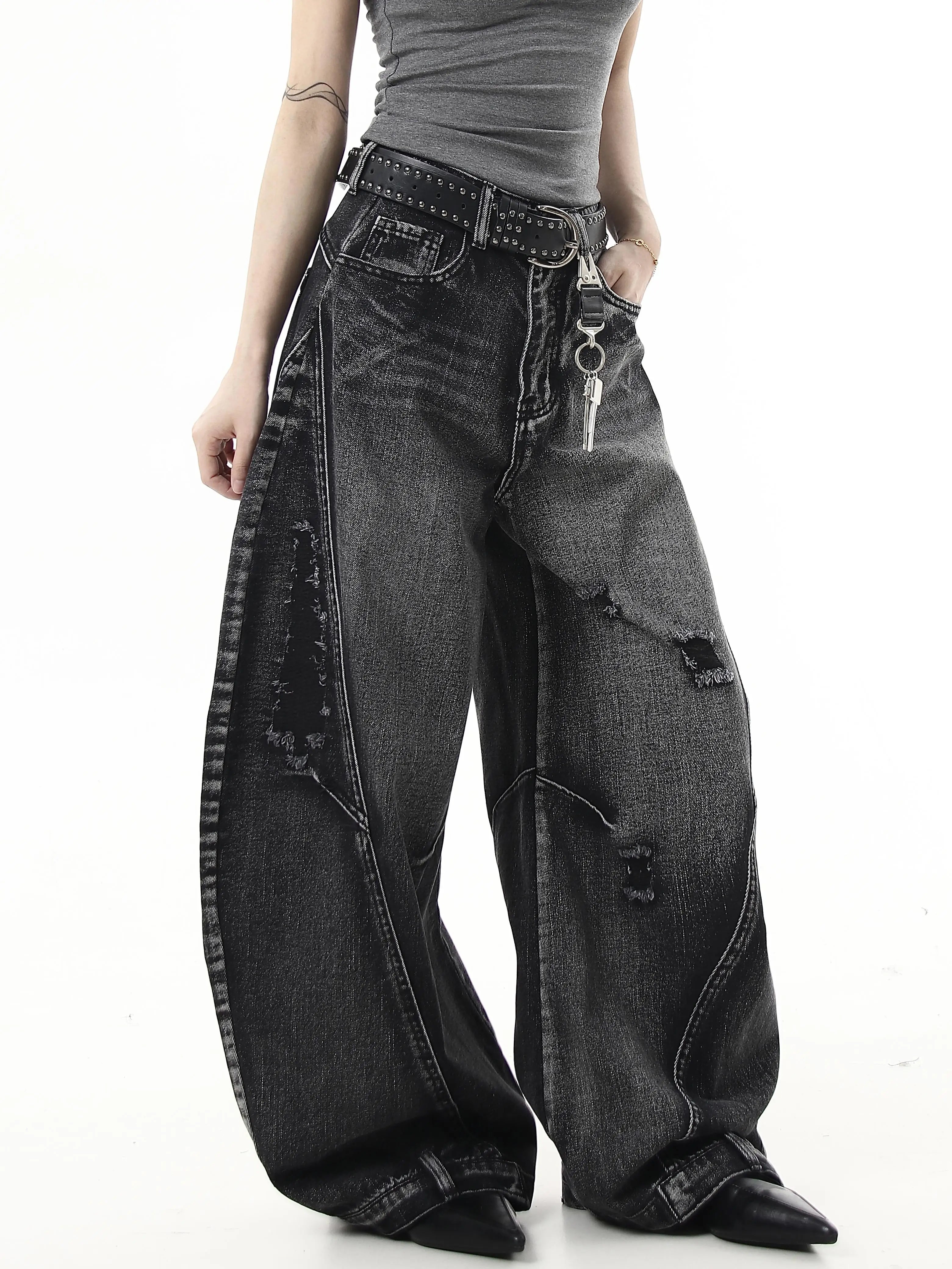 Sanhoostudio wide leg denim pants featuring washed distressing and ripped details. Designed with a curved scythe silhouette for modern high street fashion.