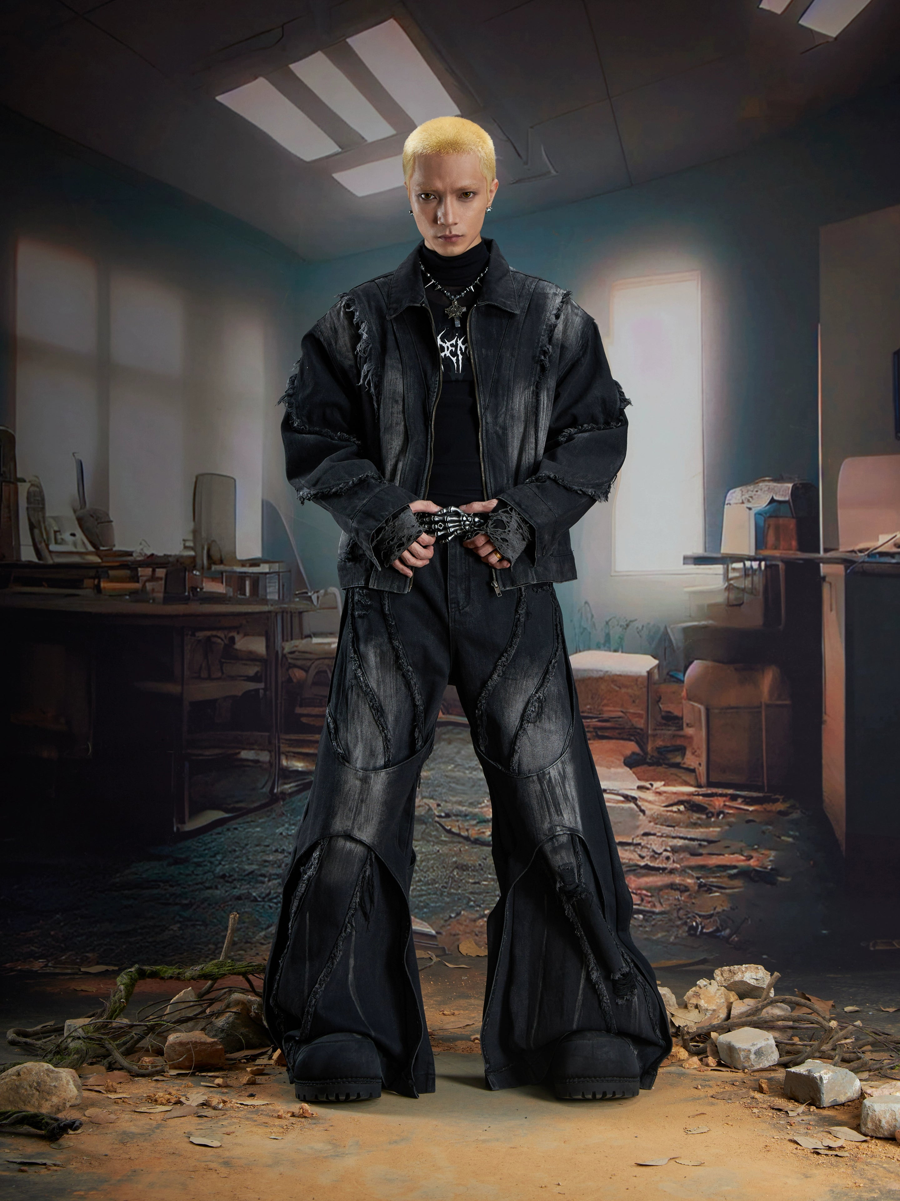 Dual-layer spliced jeans with frayed tassels, washed fading, and wide-leg construction. Sanhoostudio’s dark heavy-duty street aesthetic.