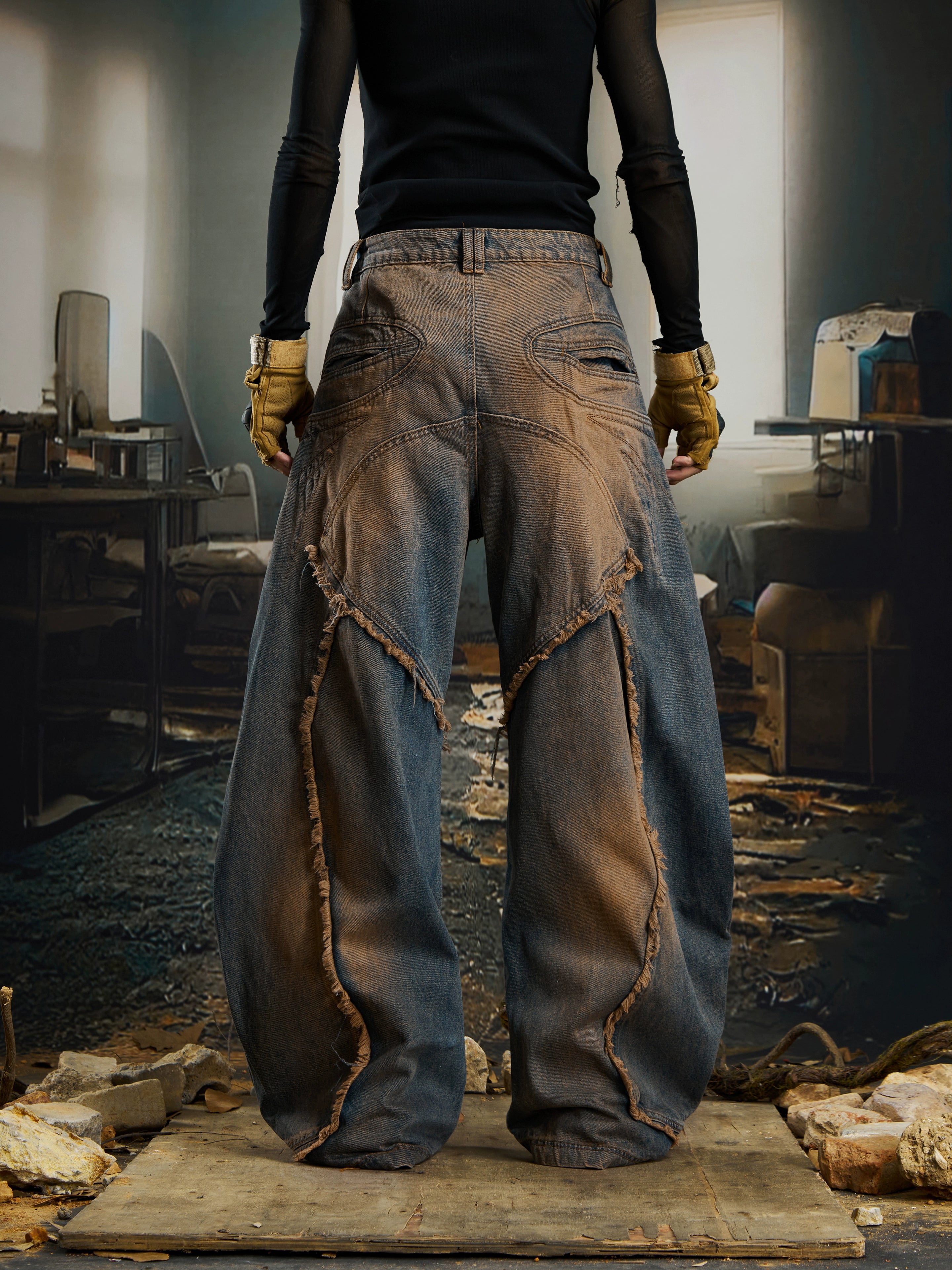 Extreme deconstructed blade-cut jeans with raw edges, washed fading, and a post-apocalyptic street silhouette. A signature Sanhoostudio statement.