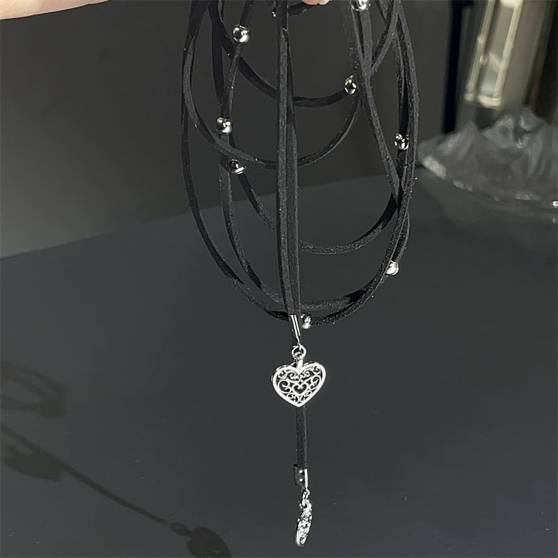 Express effortless Bohemian charm with Sanhoostudio’s silver heart wrap necklace. The long leather cord design combines vintage texture with modern simplicity.