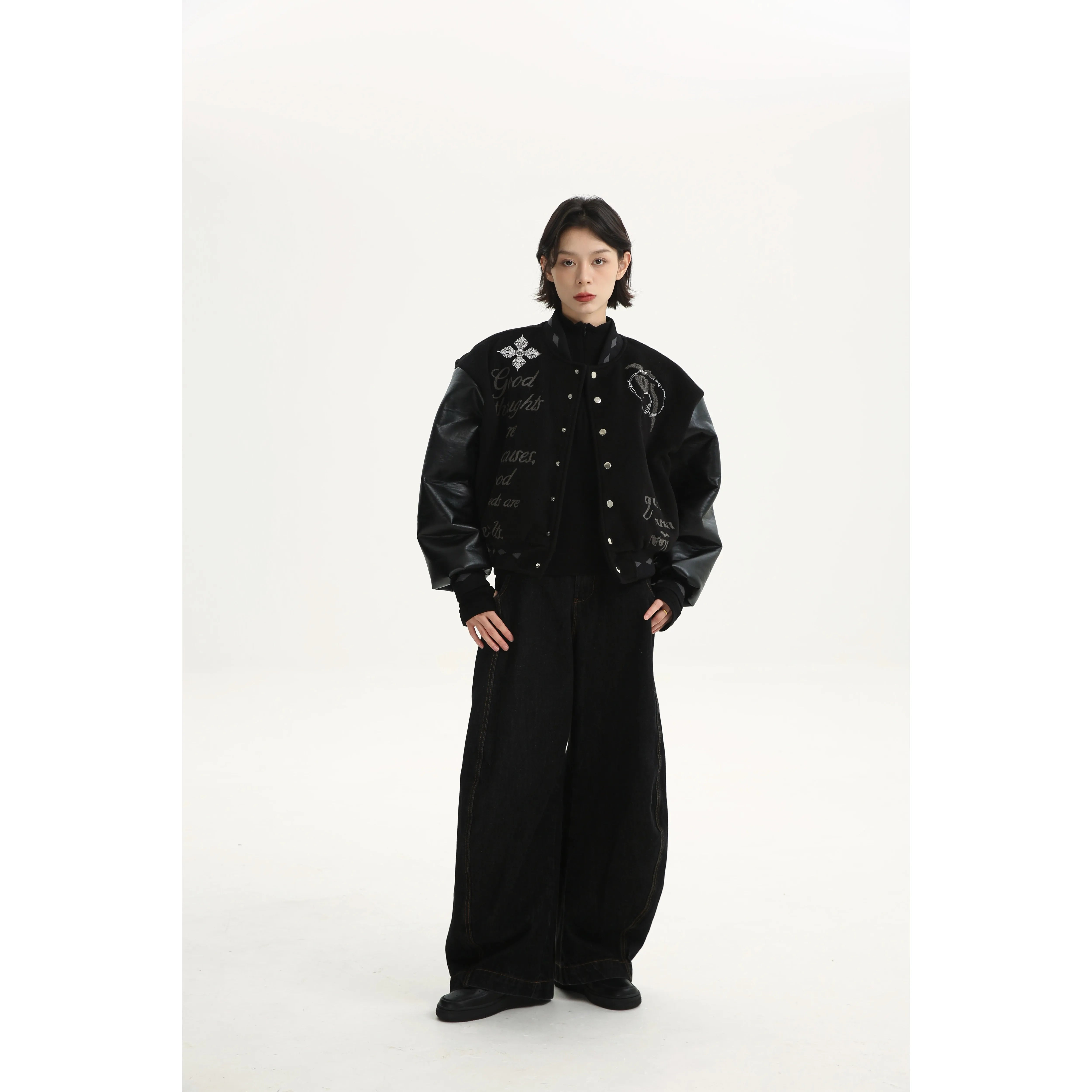 Sanhoostudio varsity jacket from the Dojie Unbound series, featuring Tibetan-inspired embroidery and heavyweight construction.